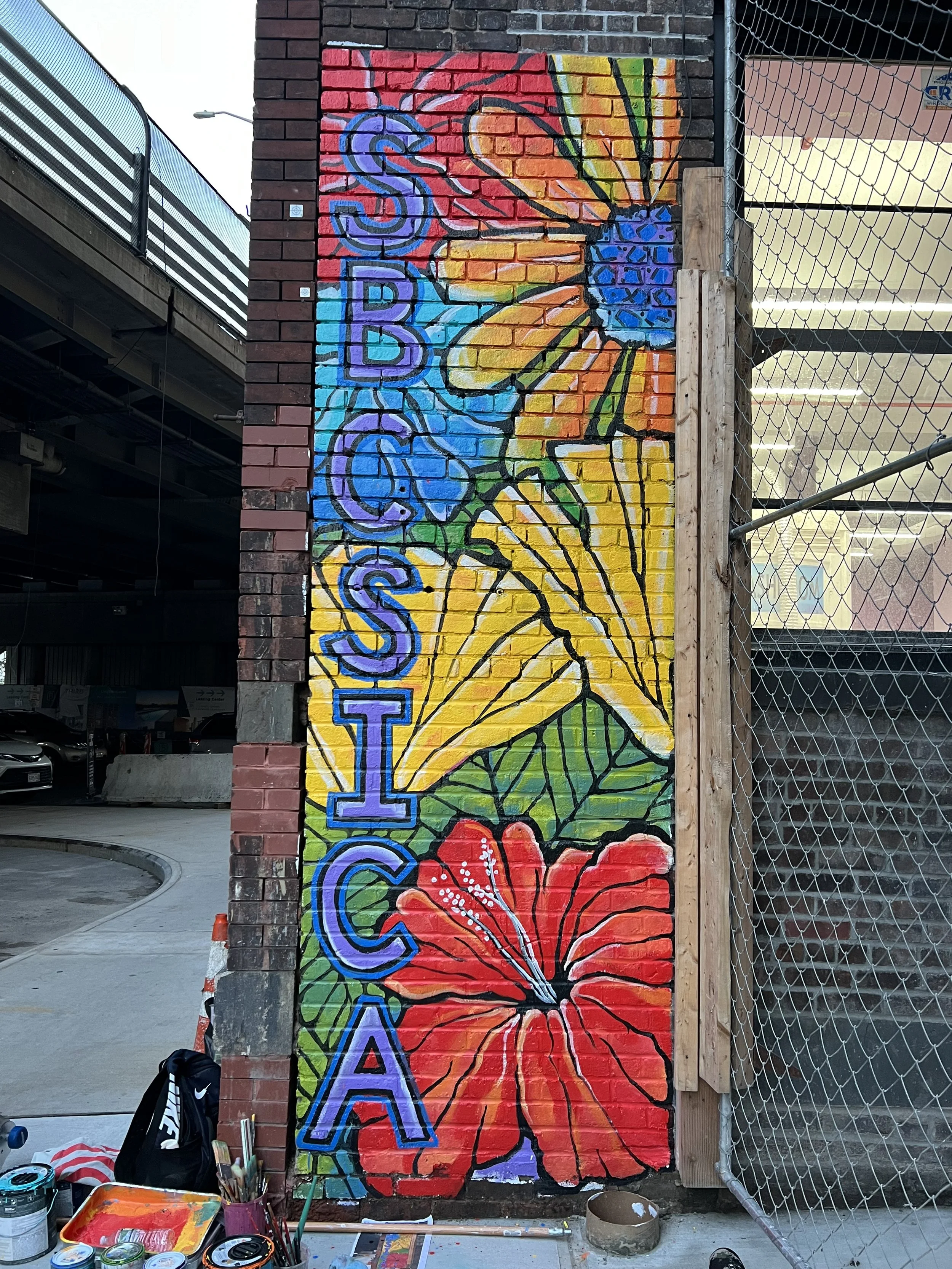 This mural, created as an address marker can be viewed from a distance highlighting the entrance of the school