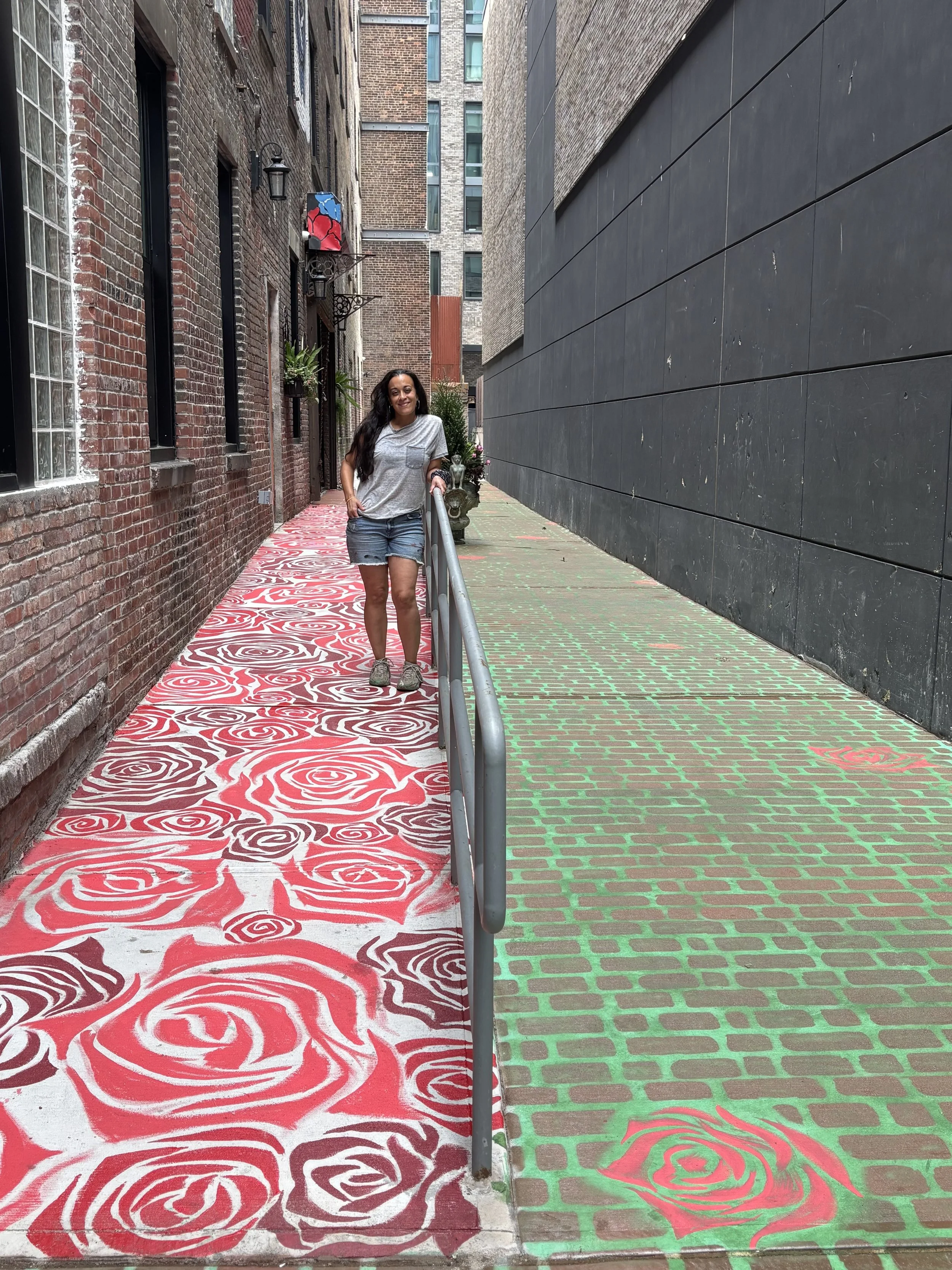 'Flowers at Your Feet' mural painted with cobblestone walkway, 125 ft x 20 ft.