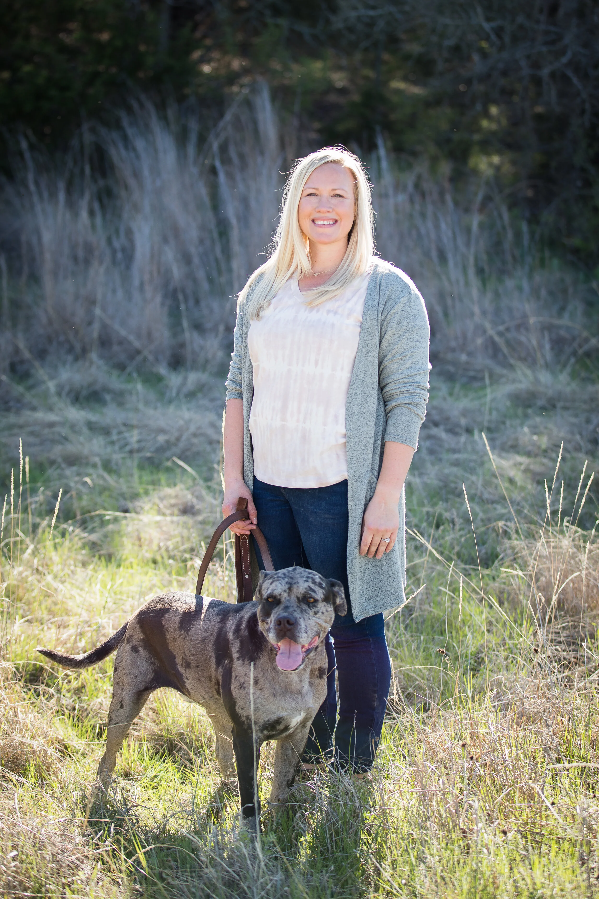 Dr. Hester with her happy dog, ready to care for your beloved pets.