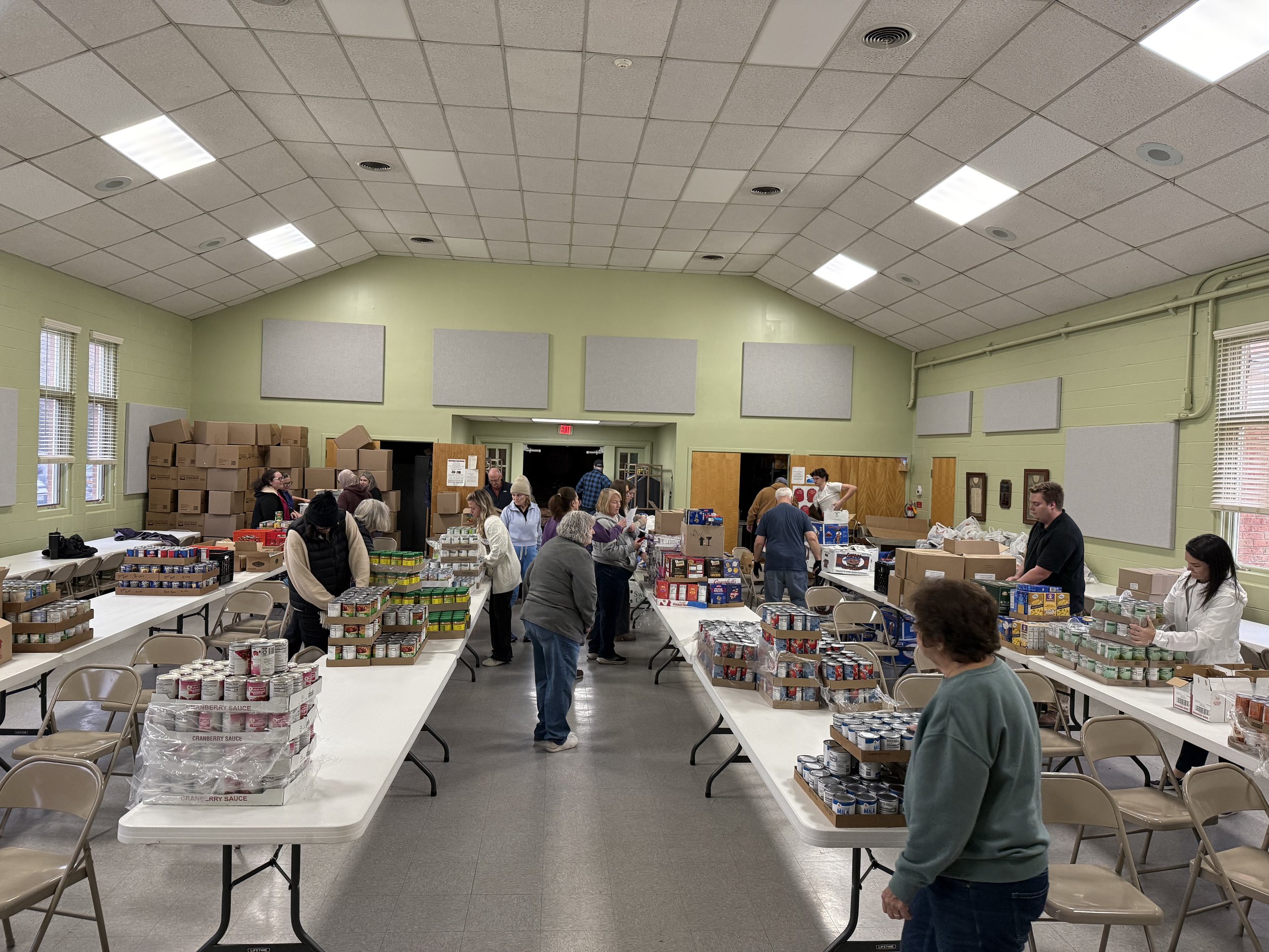 FISH voluteers filling boxes for annual Thanksgiving distribution 2025