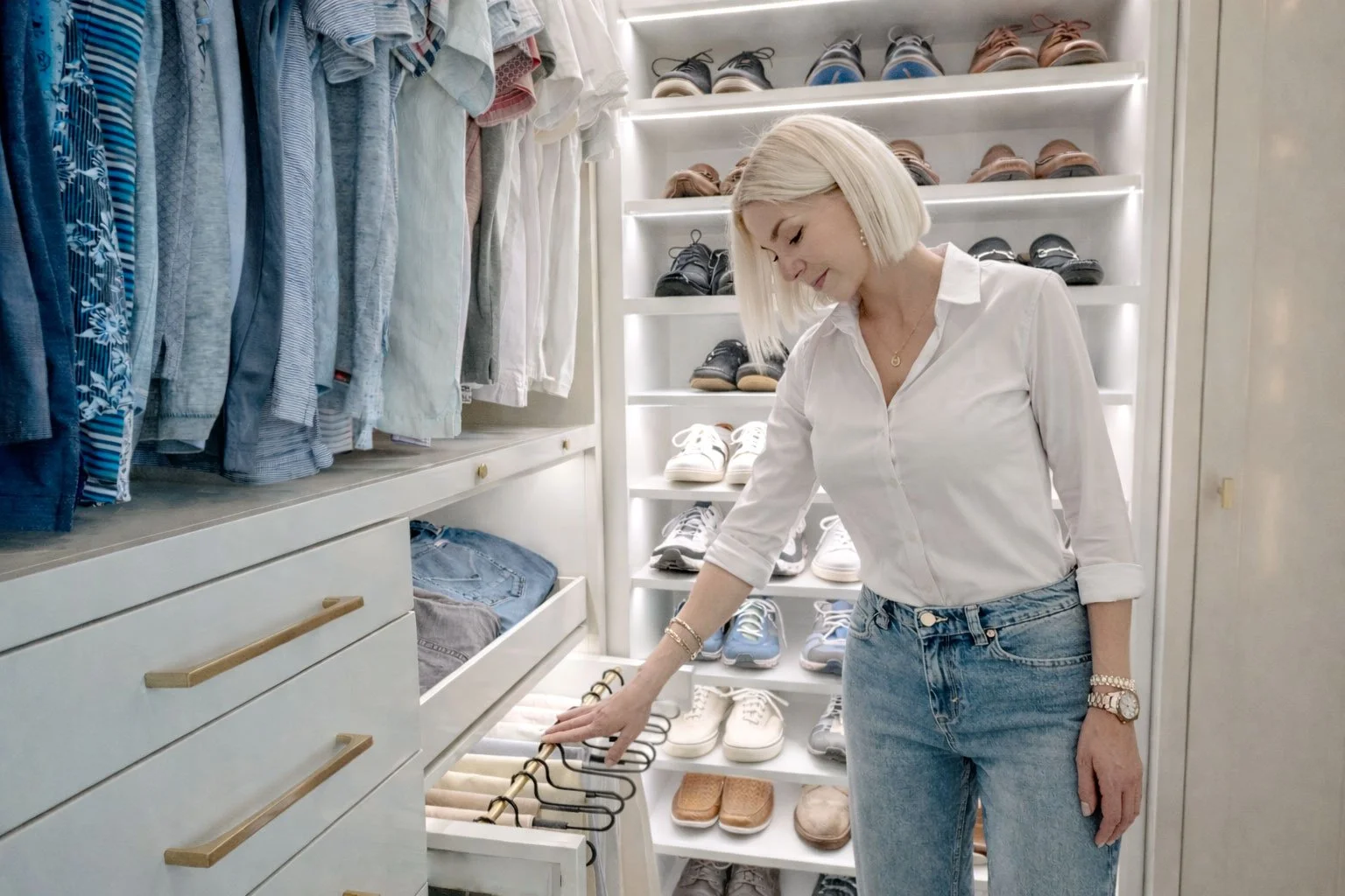Pull-out pants in a luxury custom closet.