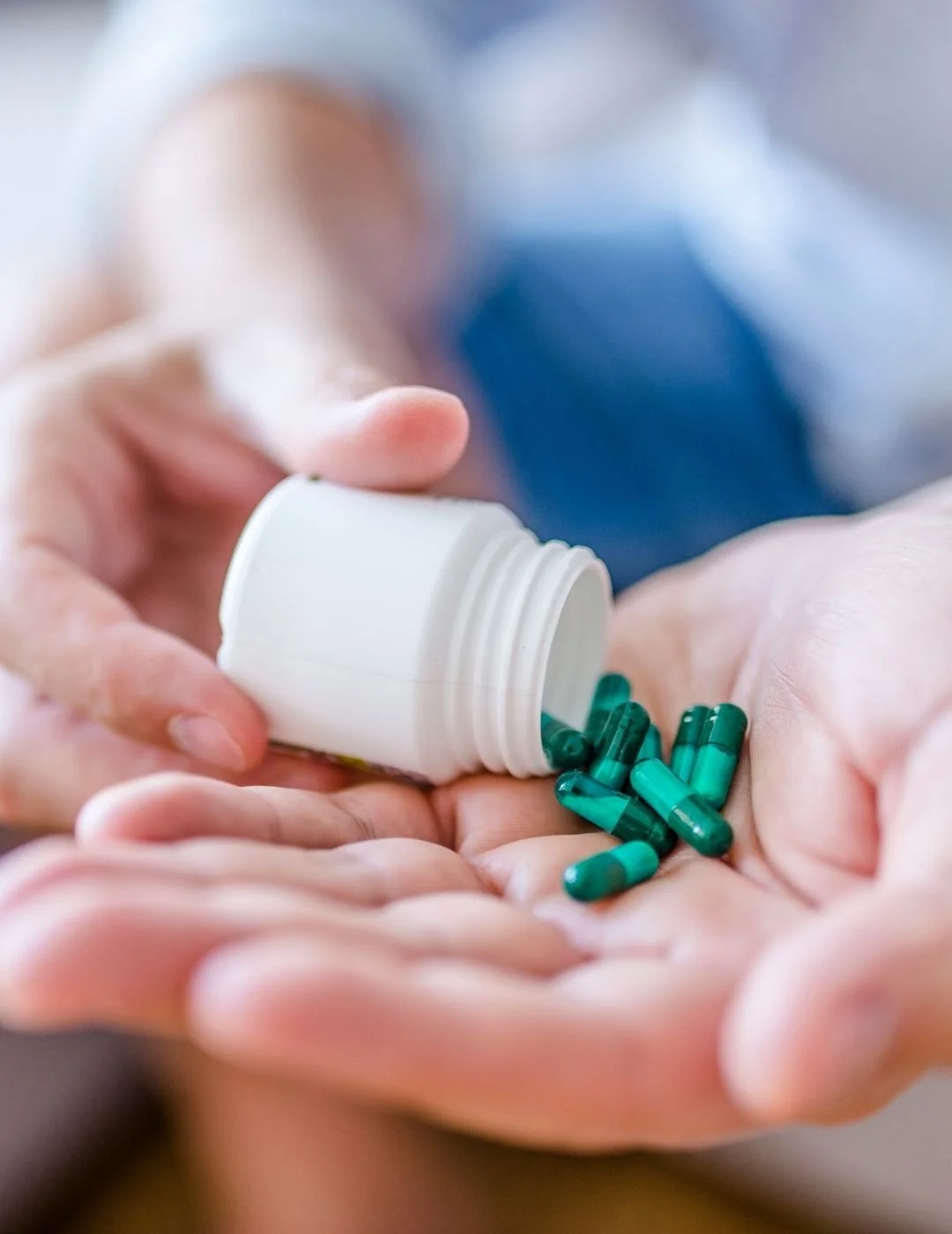 Close-up of an elderly man taking his daily prescription pills, highlighting senior medication management and healthcare compliance.