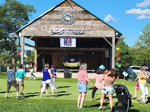 people gathered at the essex barn and green