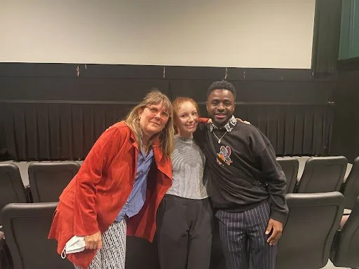 a group photo inside the cultural learning event theater space