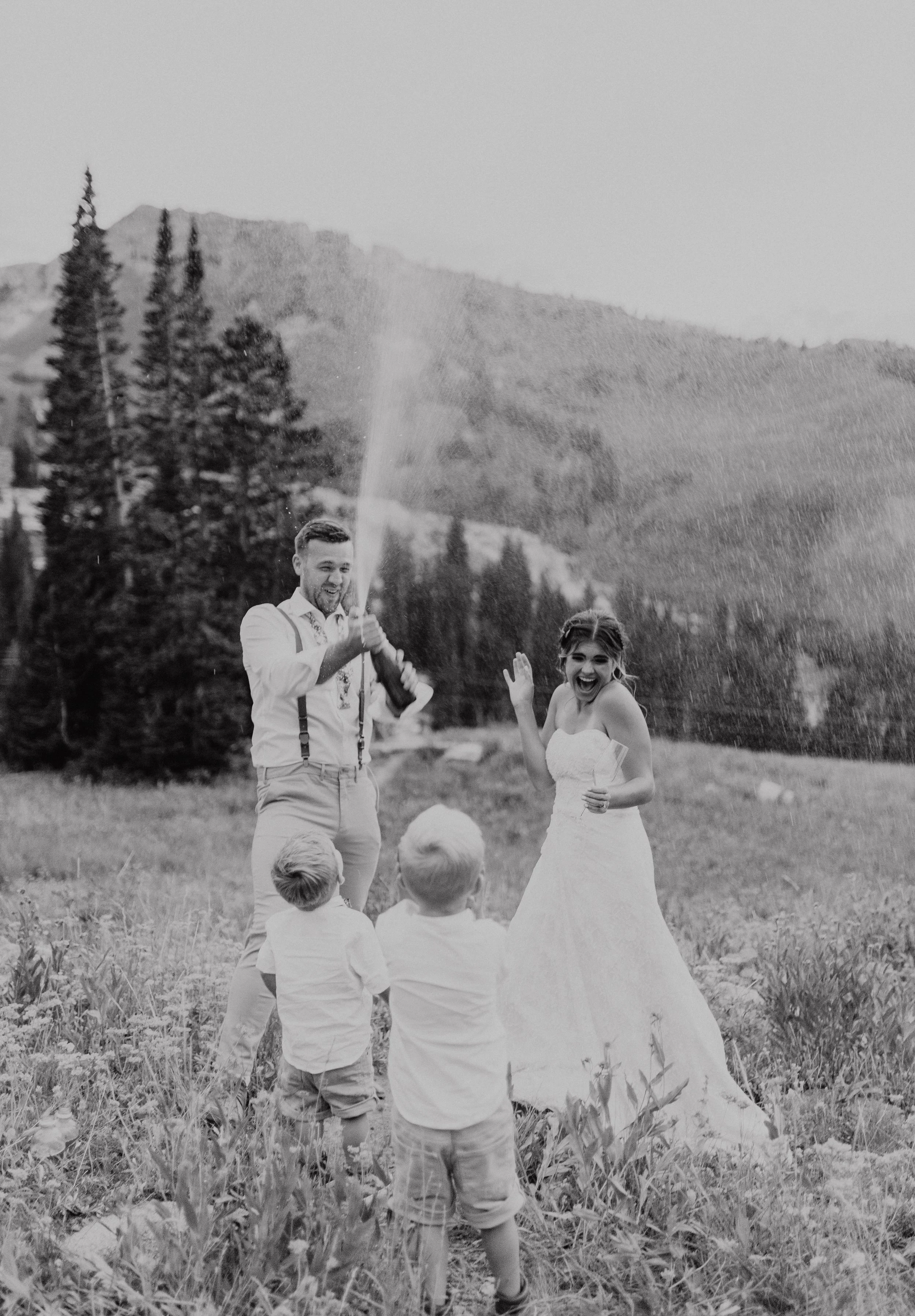 Champagne spray with family after vow renewal in mountains