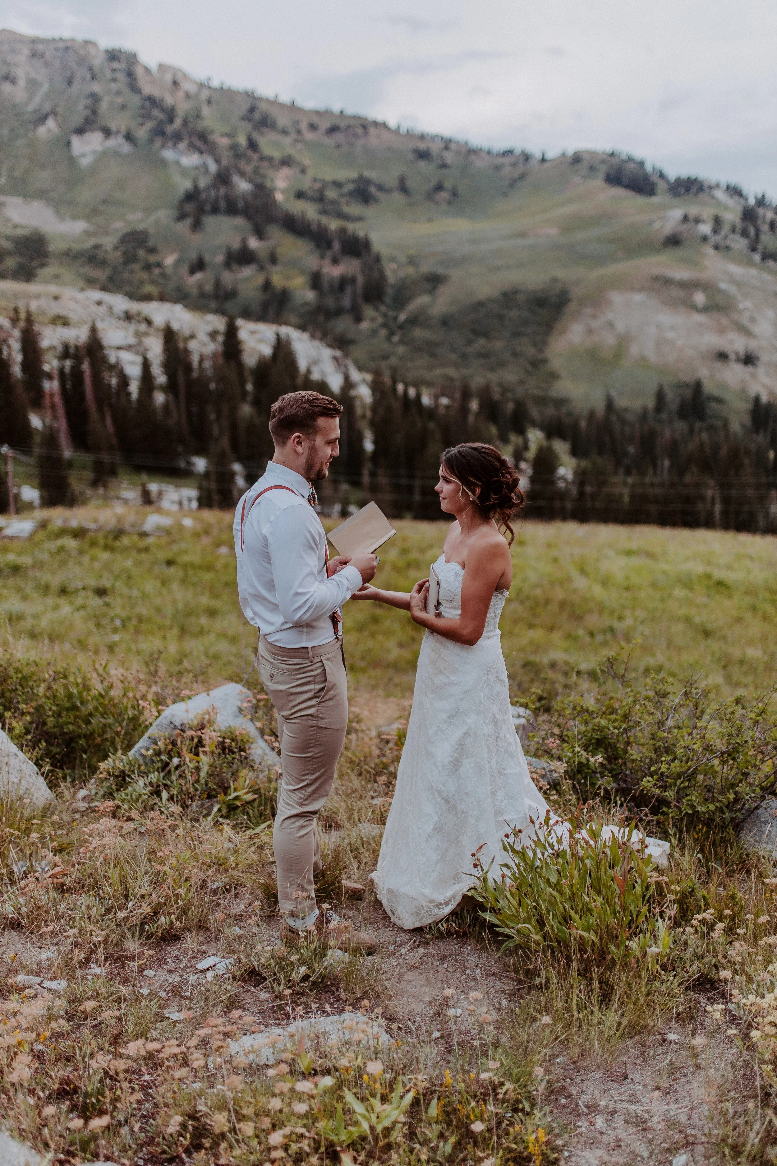 Bride and groom doing their vow renewal in the mountains