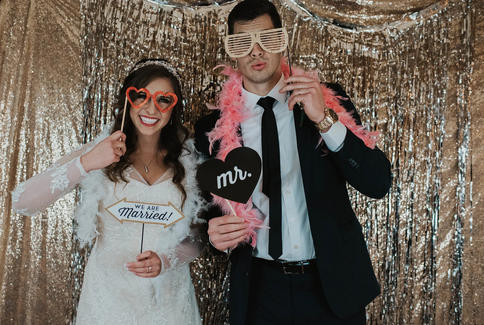 Bride and groom in front of photo booth