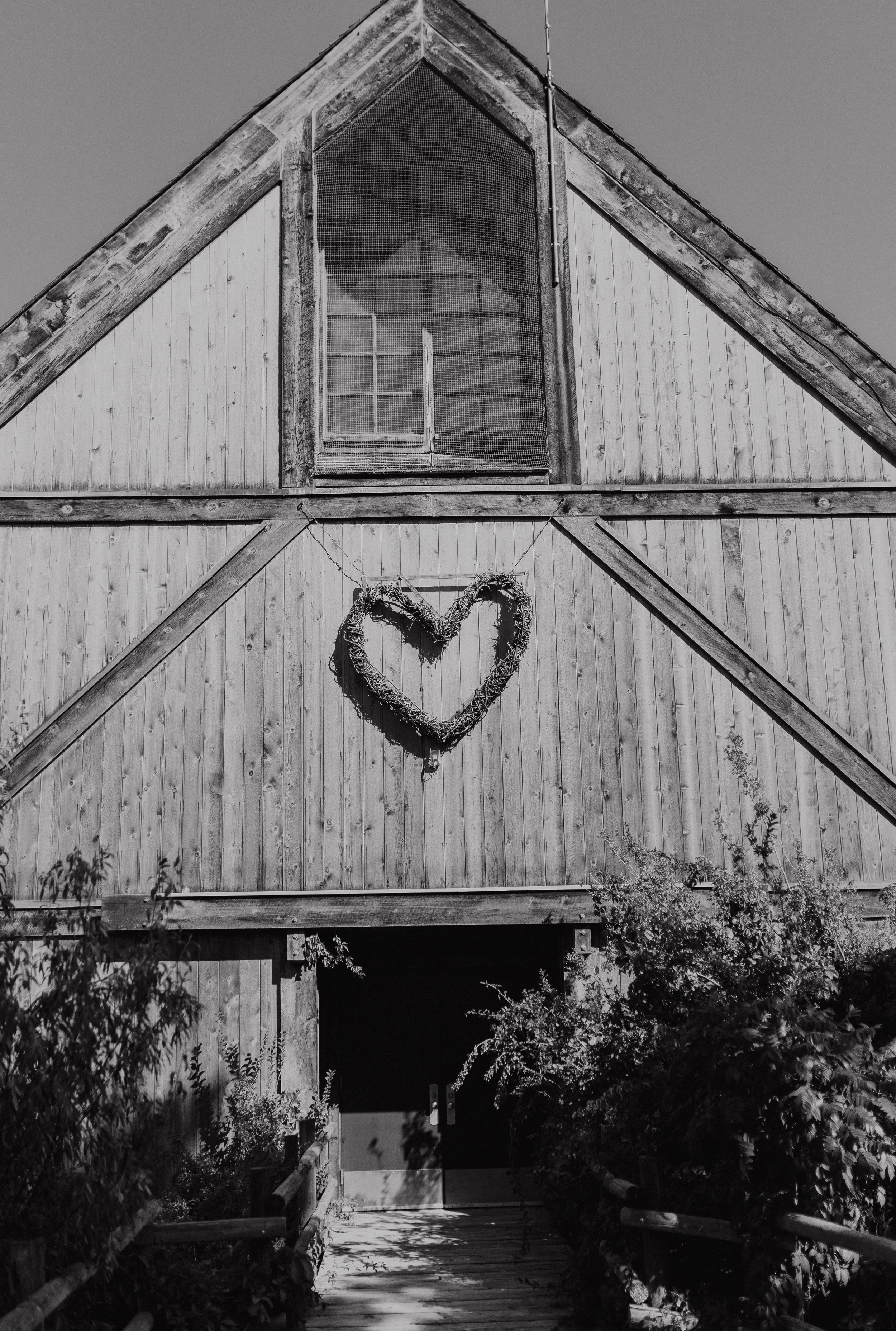 Barn with heart shaped wreath hung up on the front