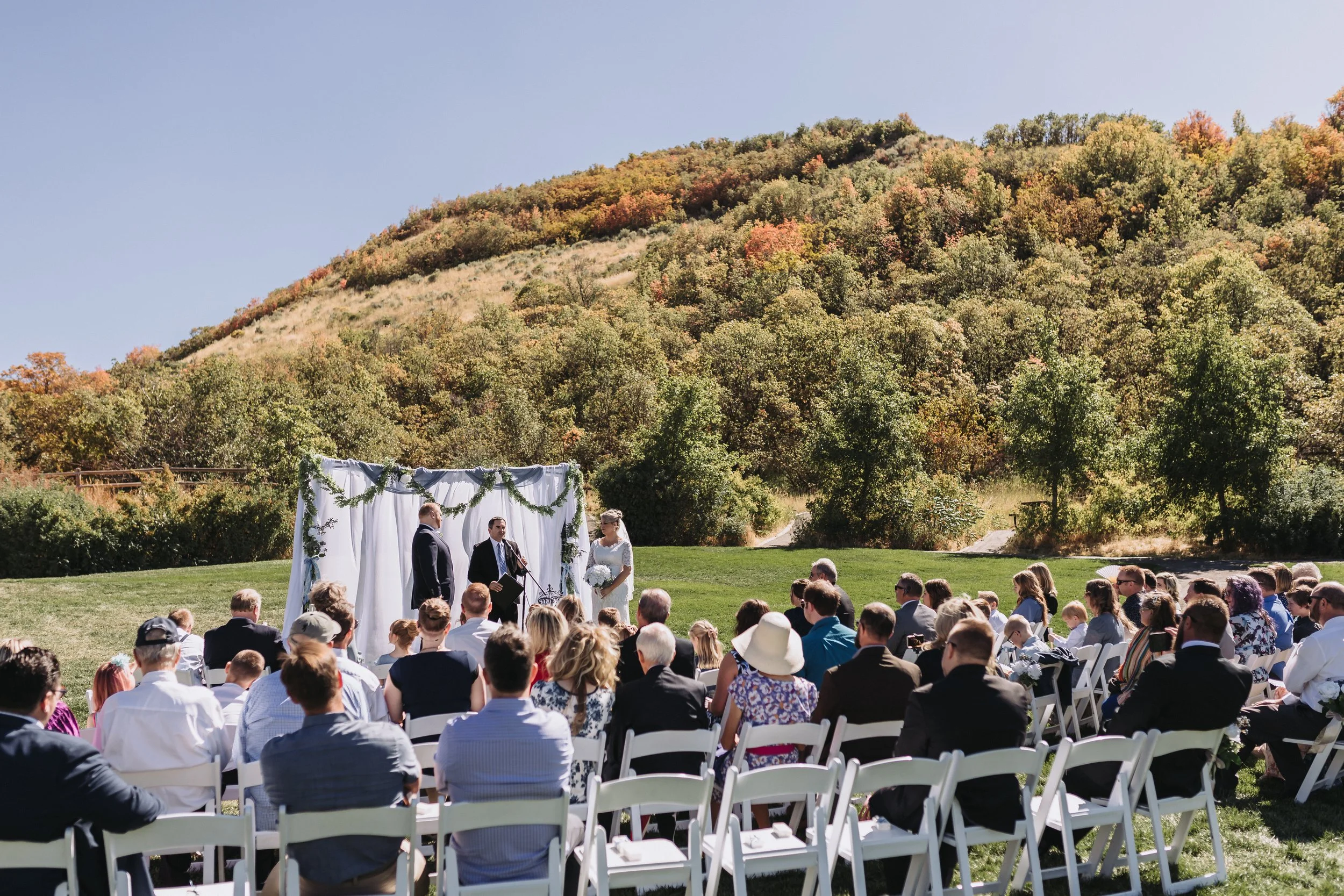 Outdoor ceremony in front of mountains