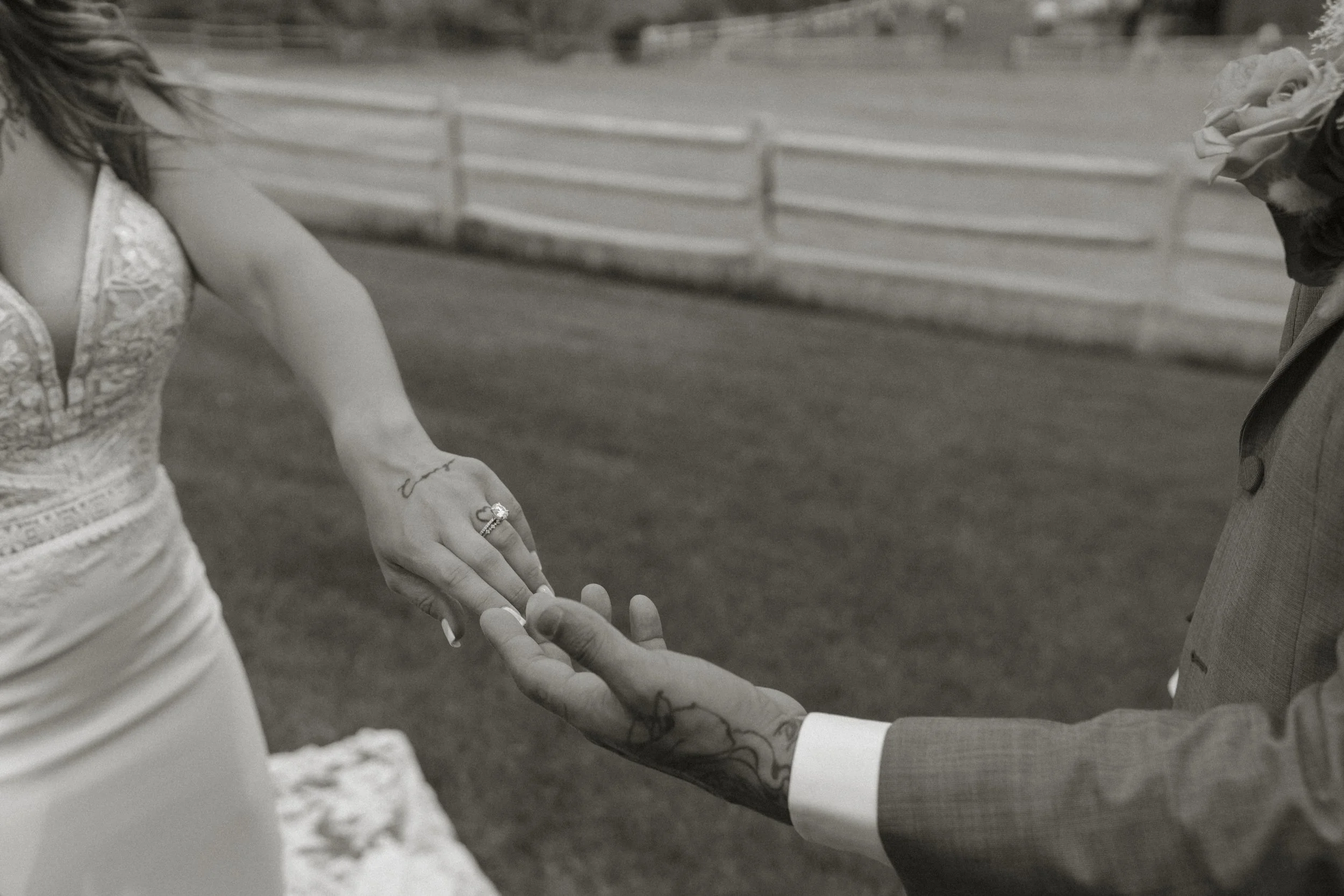 Bride and groom touching fingertips