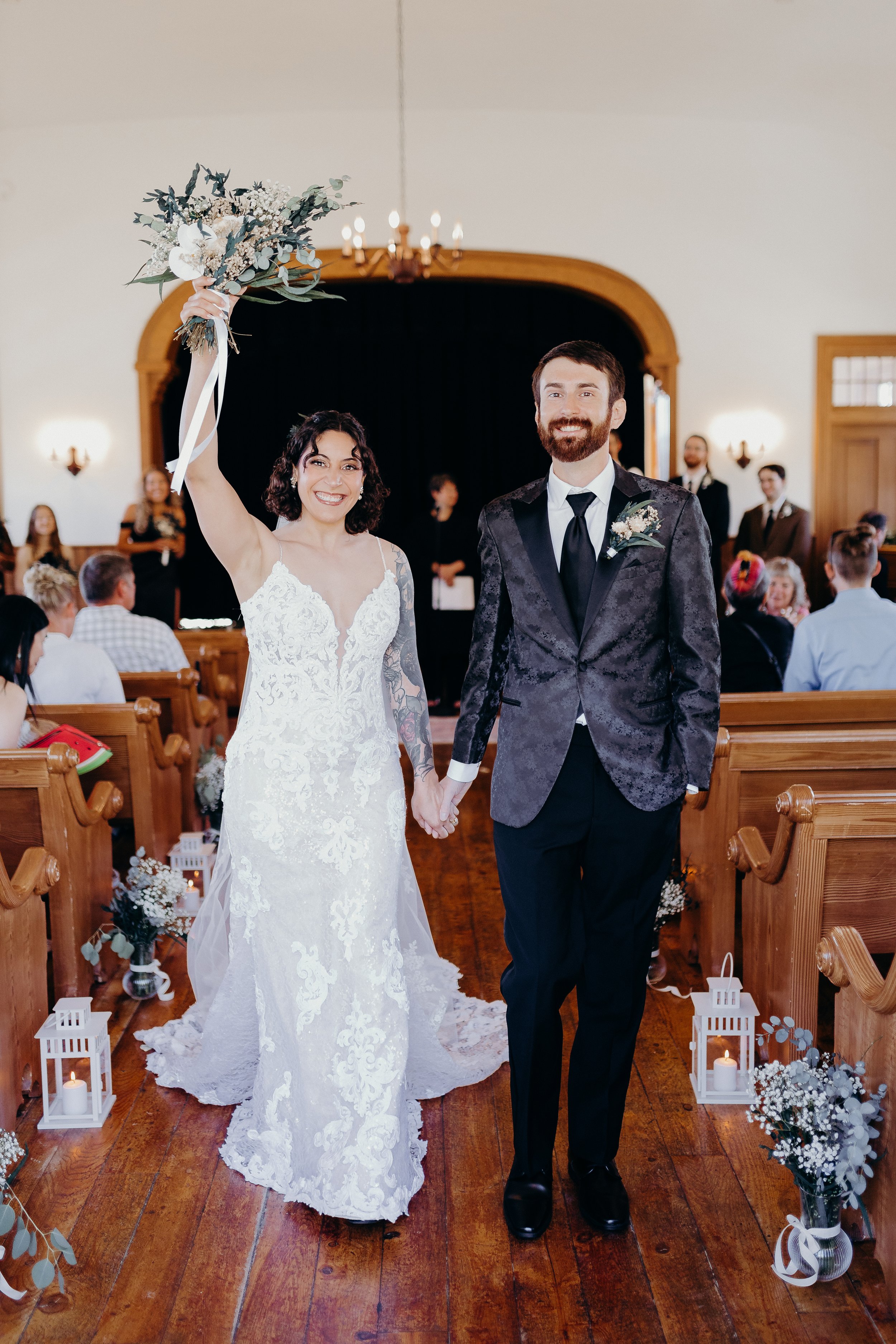 Bride and groom walking down the aisle and celebrating after the ceremony