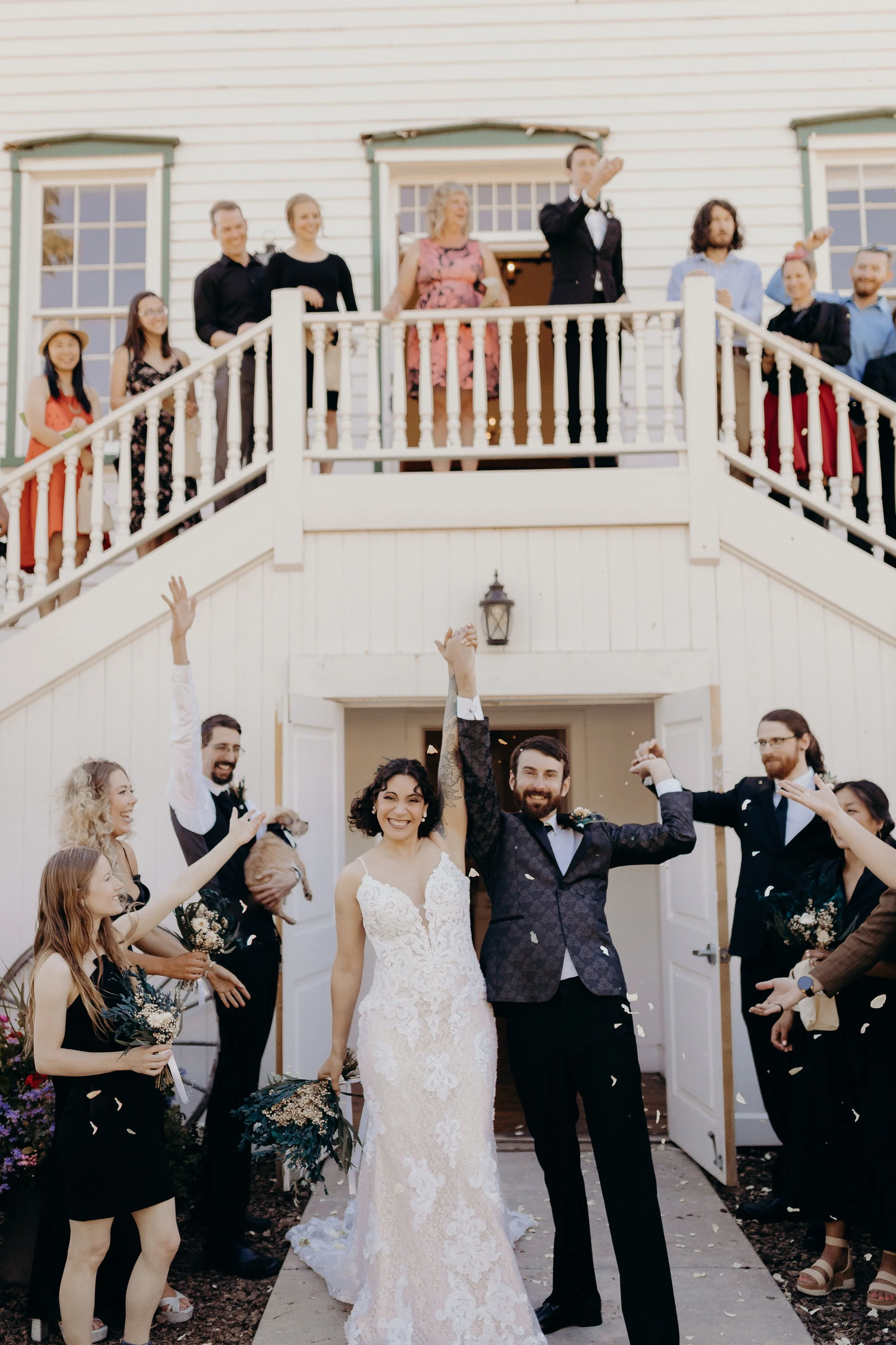 Bride and groom exiting the chapel surrounded by friends and family