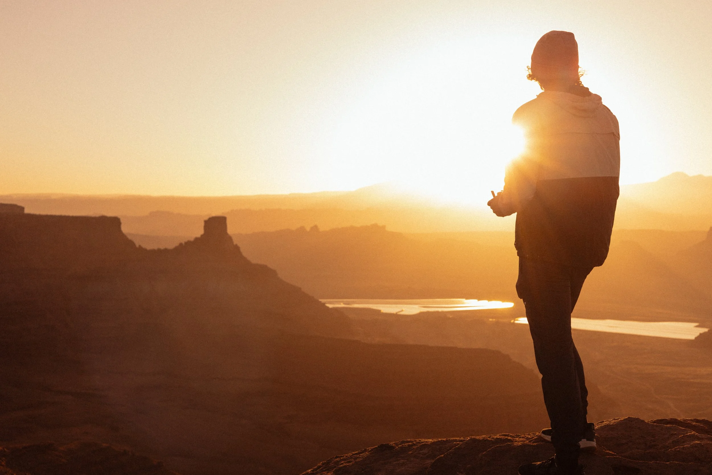 Photographer taking picture of Dead Horse State park desert at sunrise