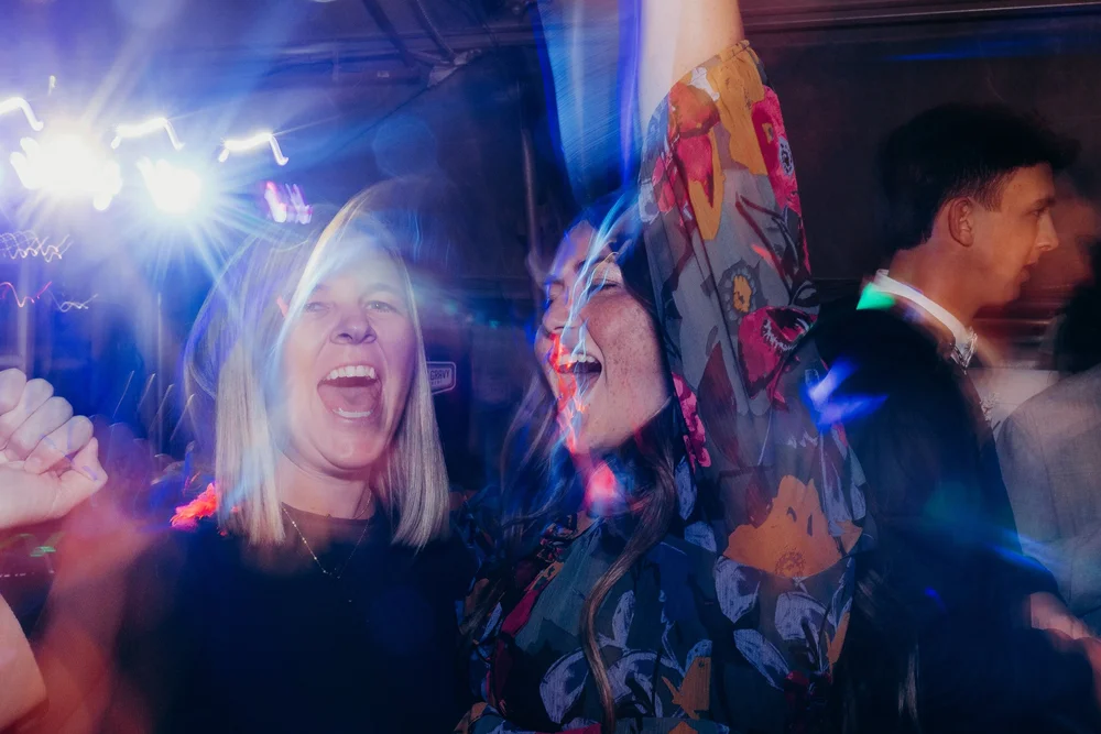 Two girls singing during reception