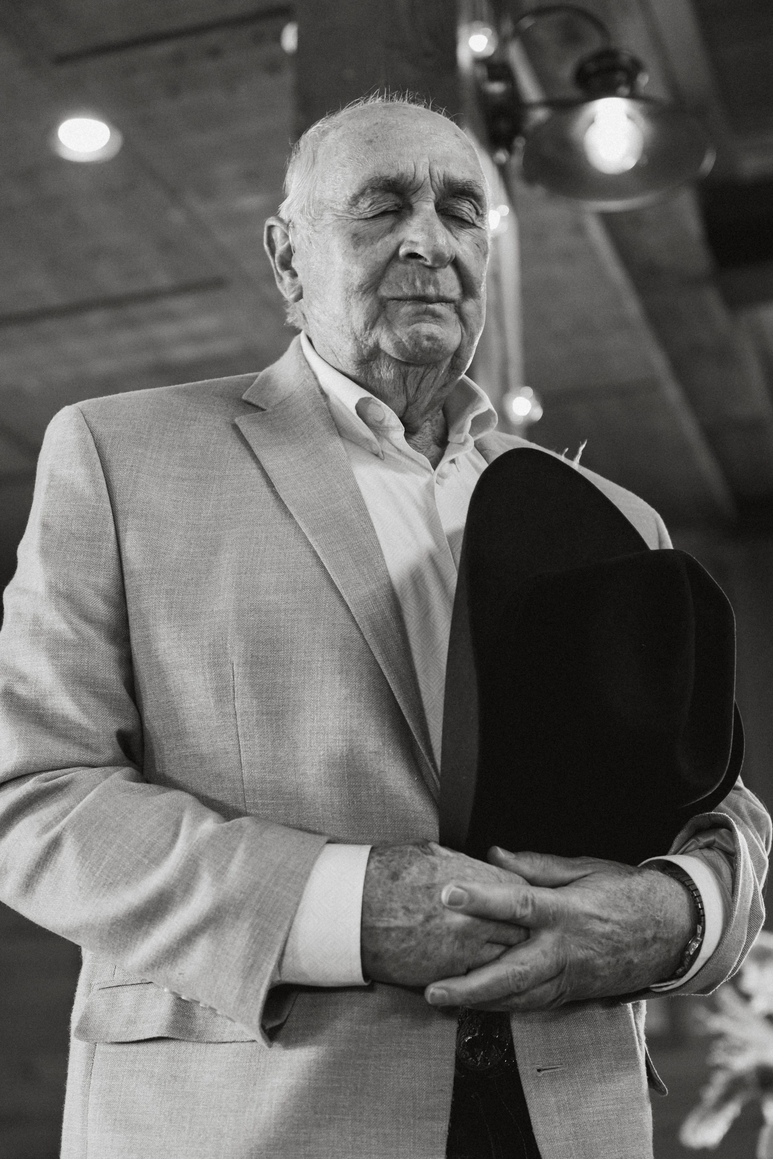 Grandfather saying grace at a wedding
