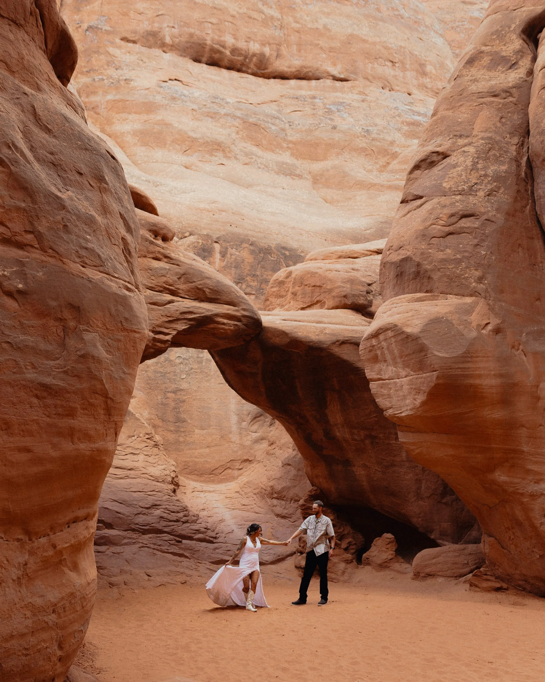 The beautiful Moab desert elopement of Brittany and AJ! 🏜️ Here is their sneak peek! 👀 

Imagine riding around the desert in side-by-sides and having fun with family and friends everyday leading up to your elopement! 🛞 🌵 🏍️ That&rsquo;s exactly 