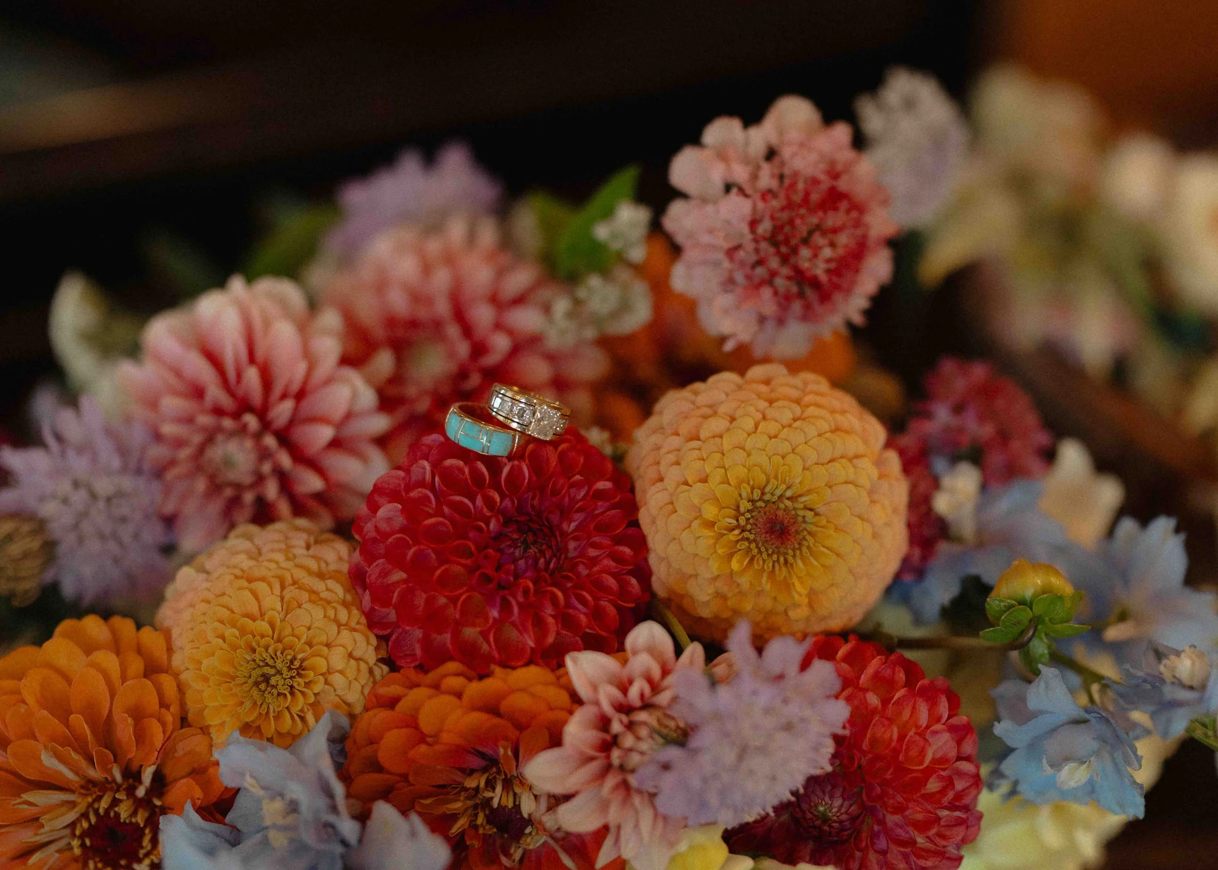 rings on floral arrangement of rainbow colors
