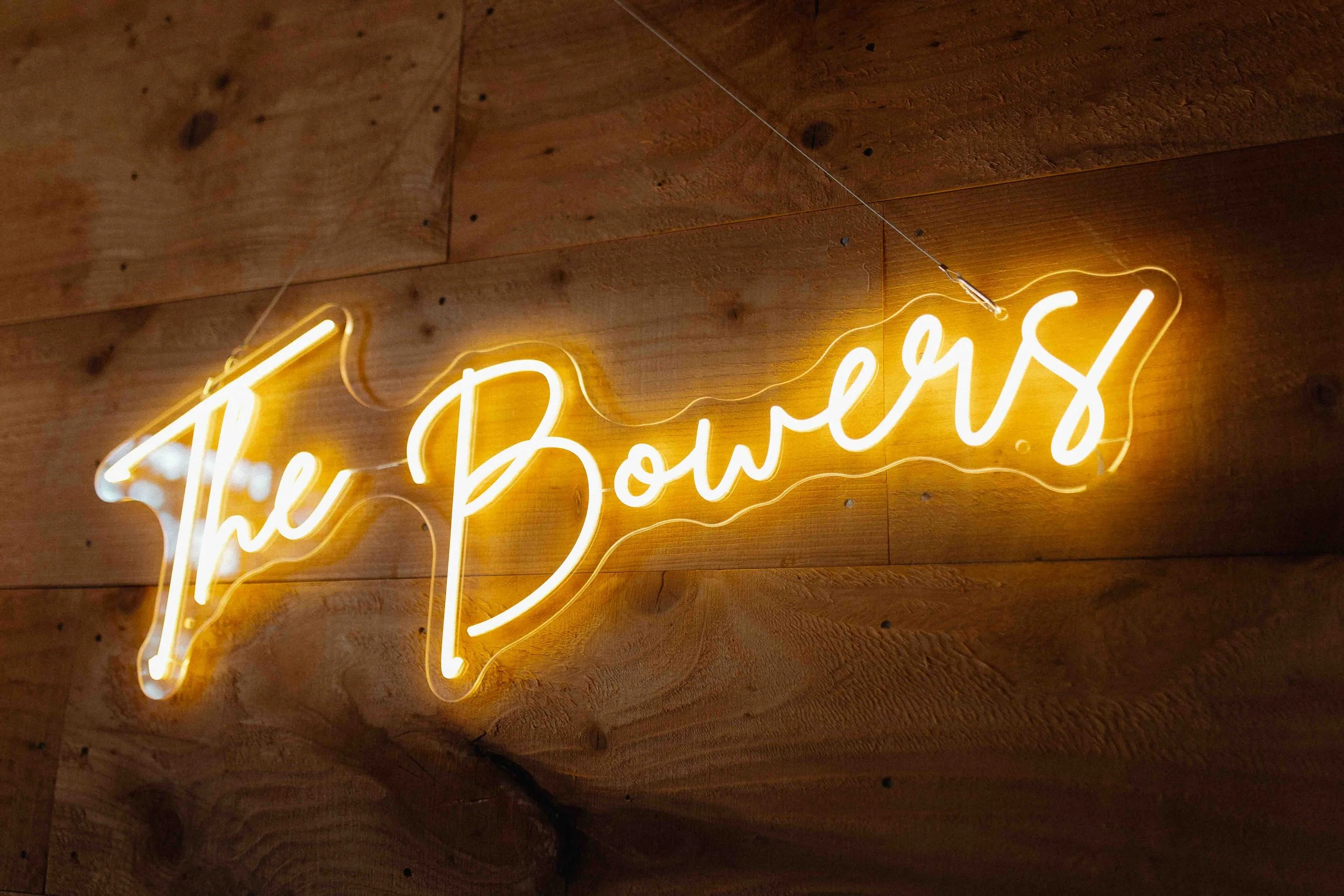Neon wedding sign that says, "The Bowers."