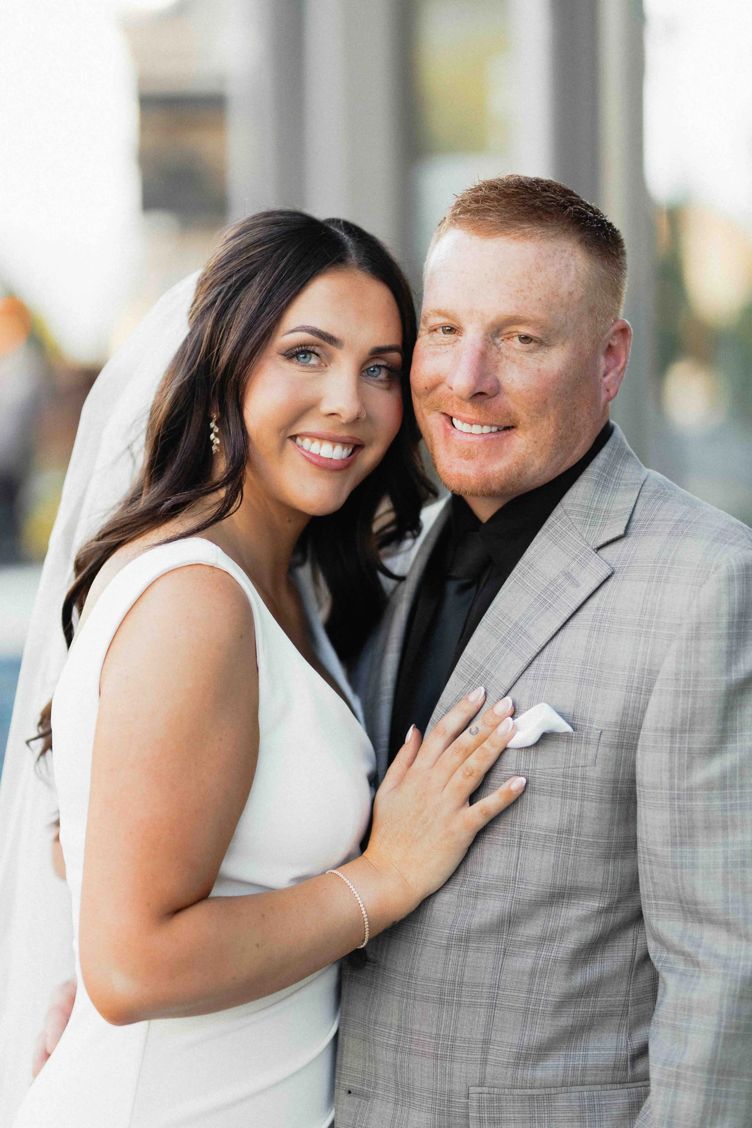 Bride and groom smiling.