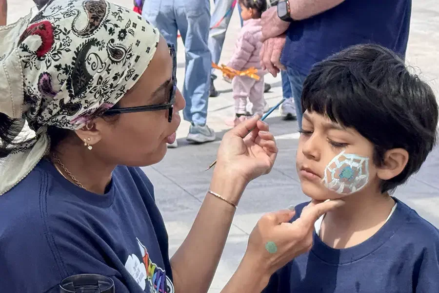 face-painting-at-walk-for-kids-event.webp