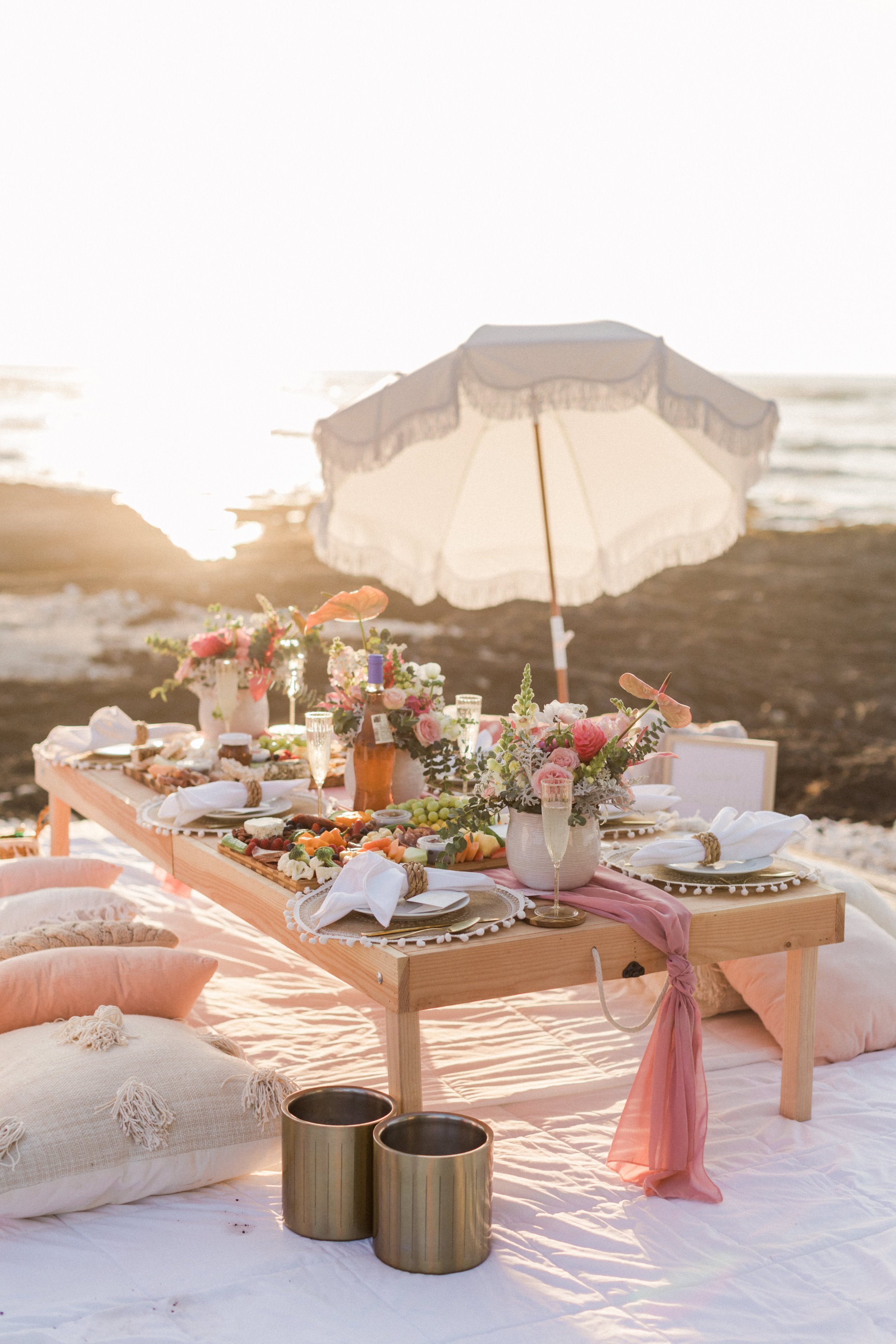 Tropical florals for a bachelorette picnic on the beach in Hawaii