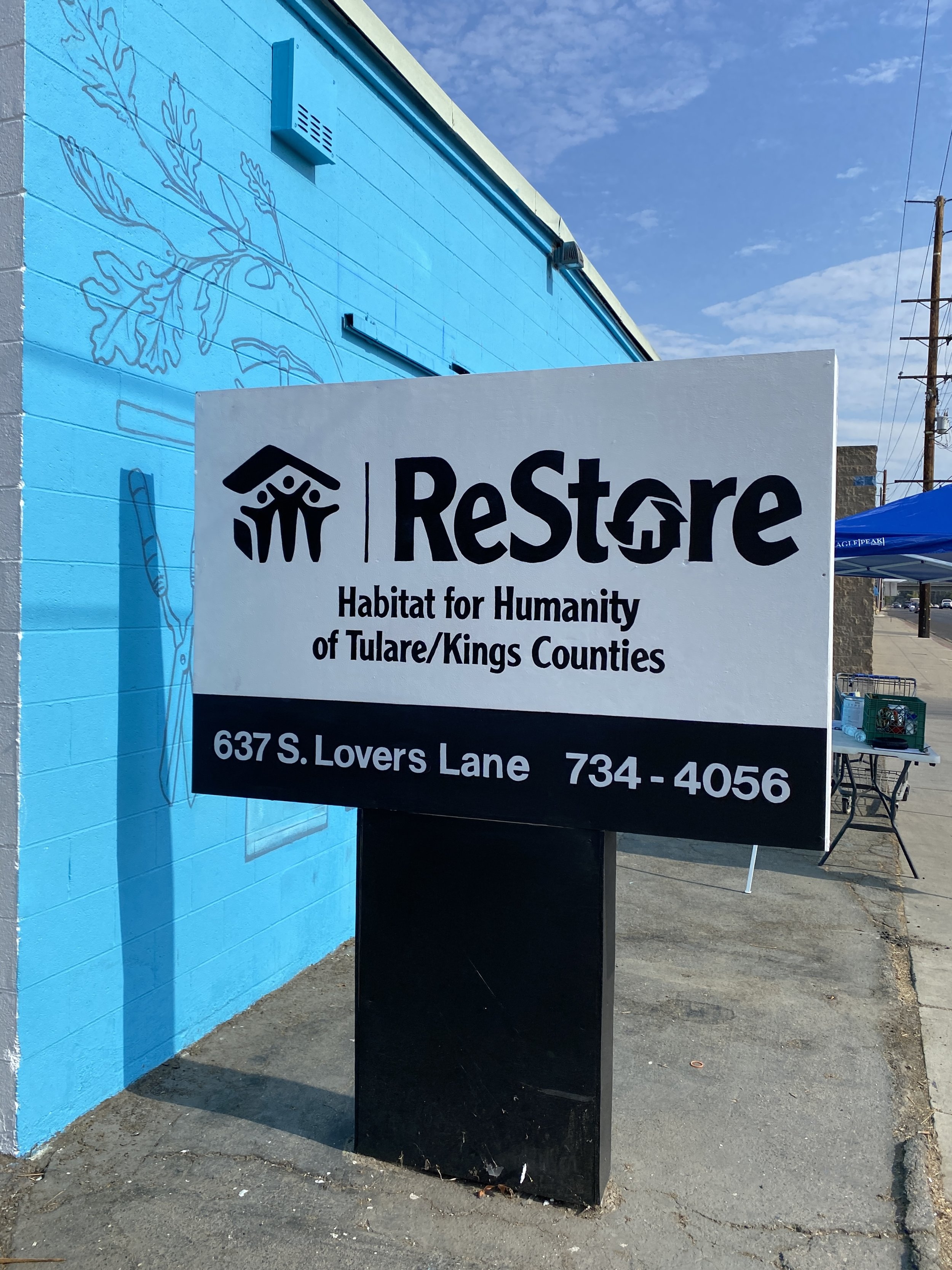 Handpainted logo and signage at Habitat for Humanity of Tulare/Kings Counties, Visalia CA. 2022. 
