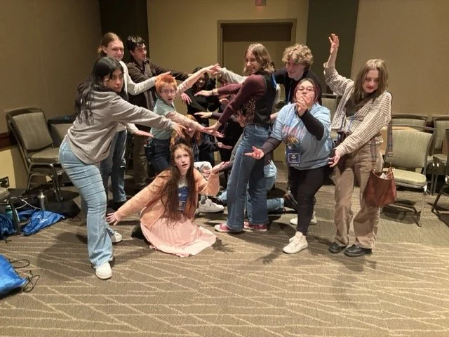 Students pose in a tableau