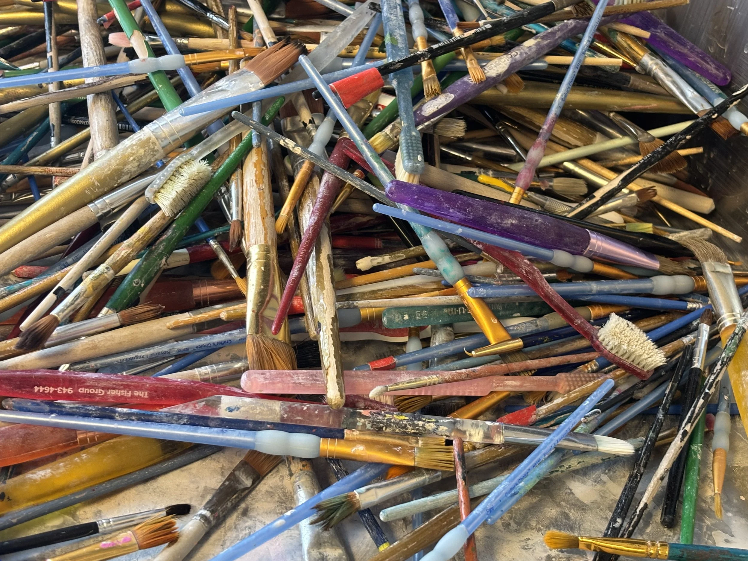 Close up of various used art materials