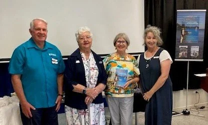 Redlands Museum team with Christine talking about her Coochie book
