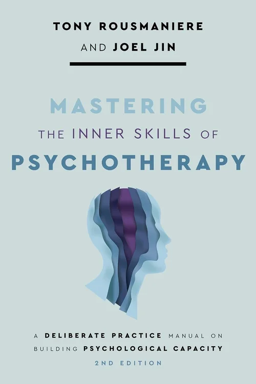 Cover of the second edition of 'Mastering the Inner Skills of Psychotherapy' by Tony Rousmaniere and Joel Jin, with a layered paper-cut illustration of a head in blues and purple.