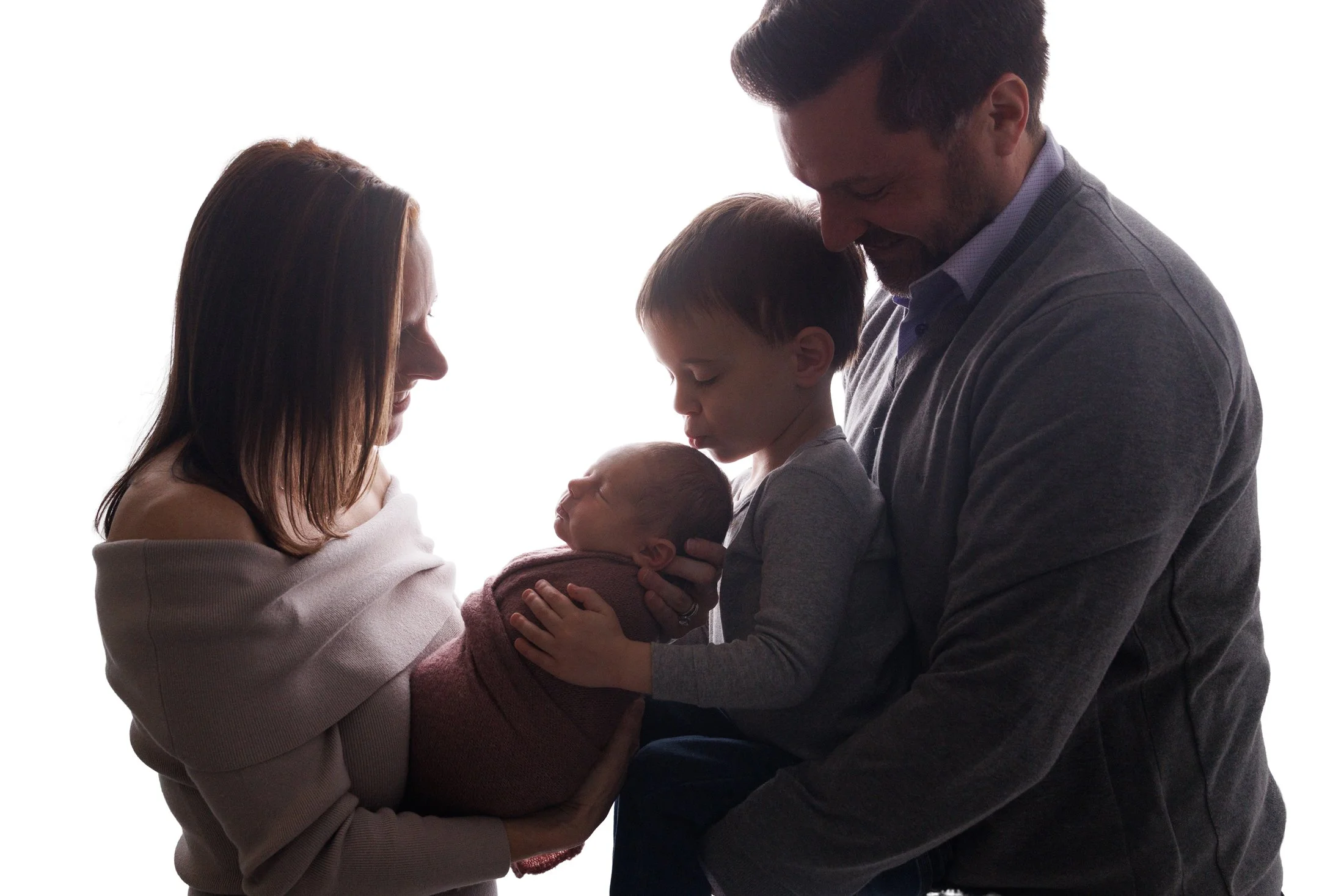 silhouette of family of 4 with baby and toddler