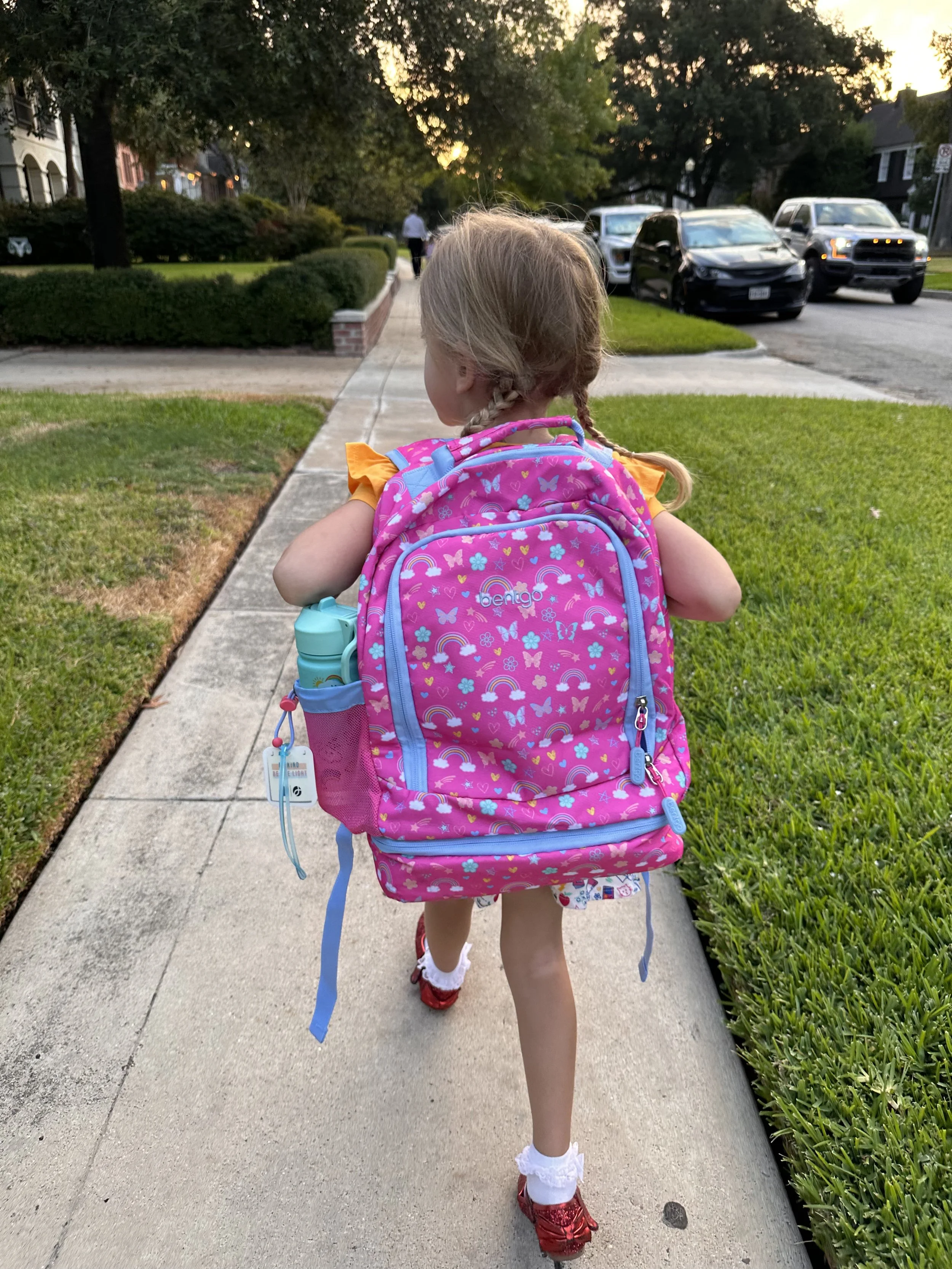 Kid from behind with backpack on