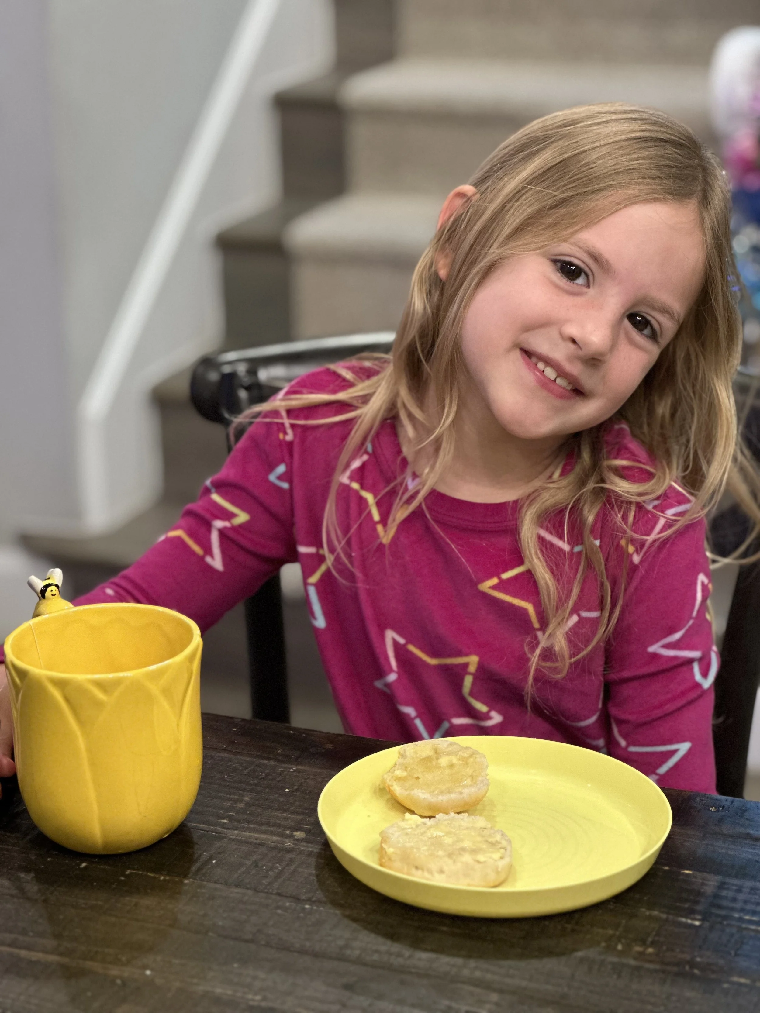 kid at table drinking tea