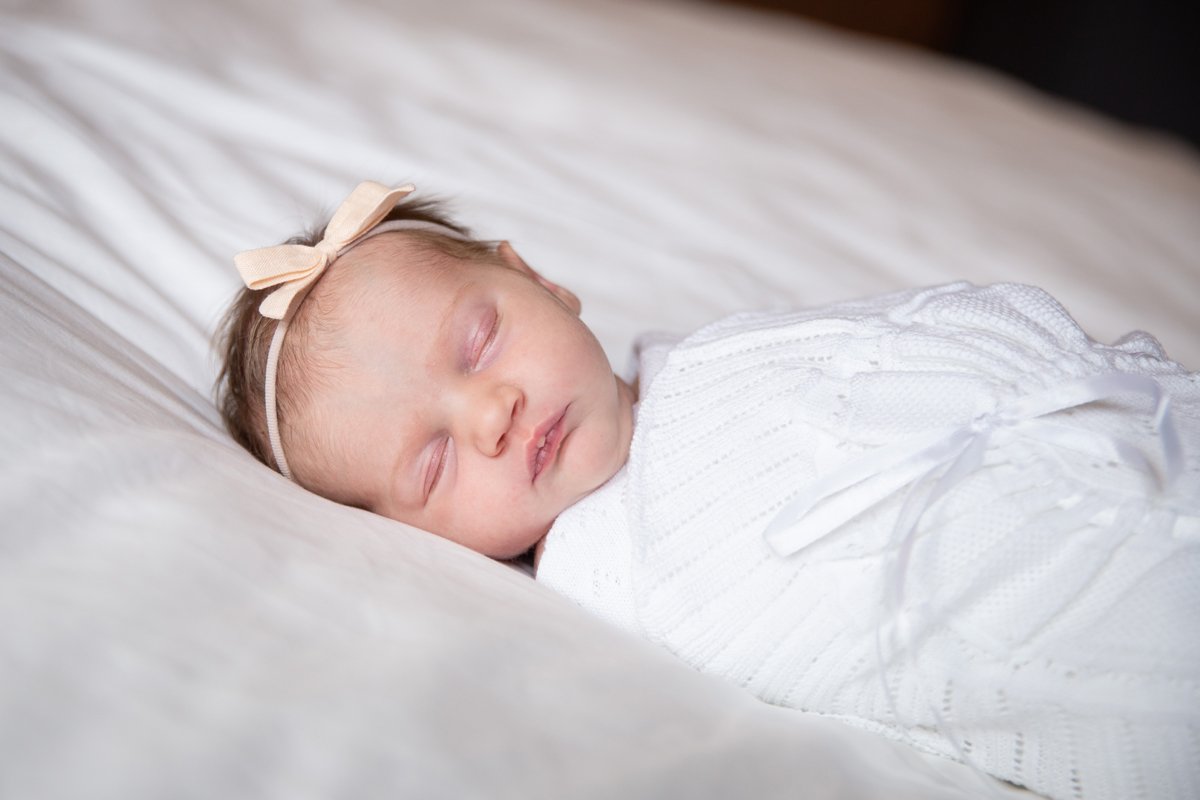newborn on bed