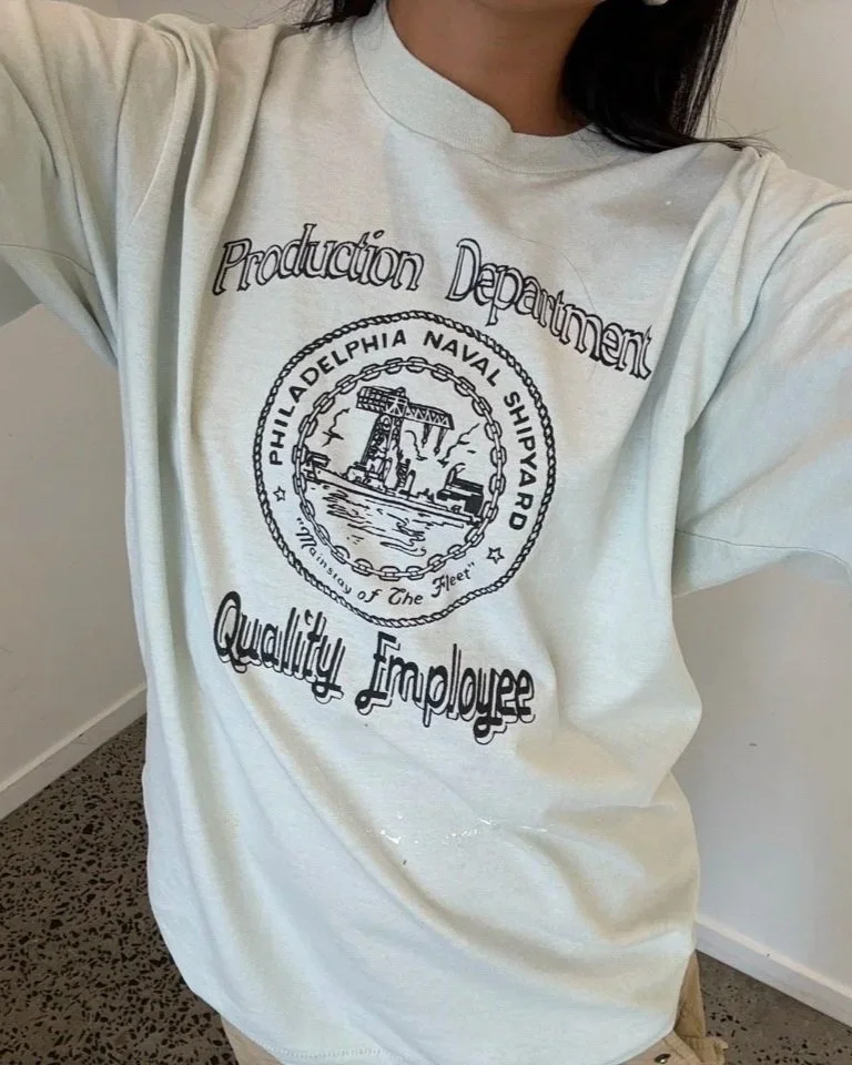 Vintage white Philadelphia Naval Shipyard t-shirt showing black seal print across the chest