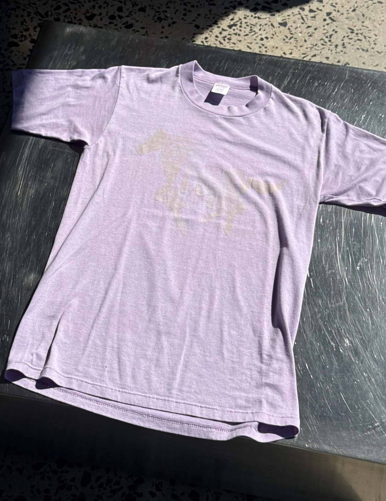 Vintage faded lilac Kentucky horse t-shirt laid flat, full front view