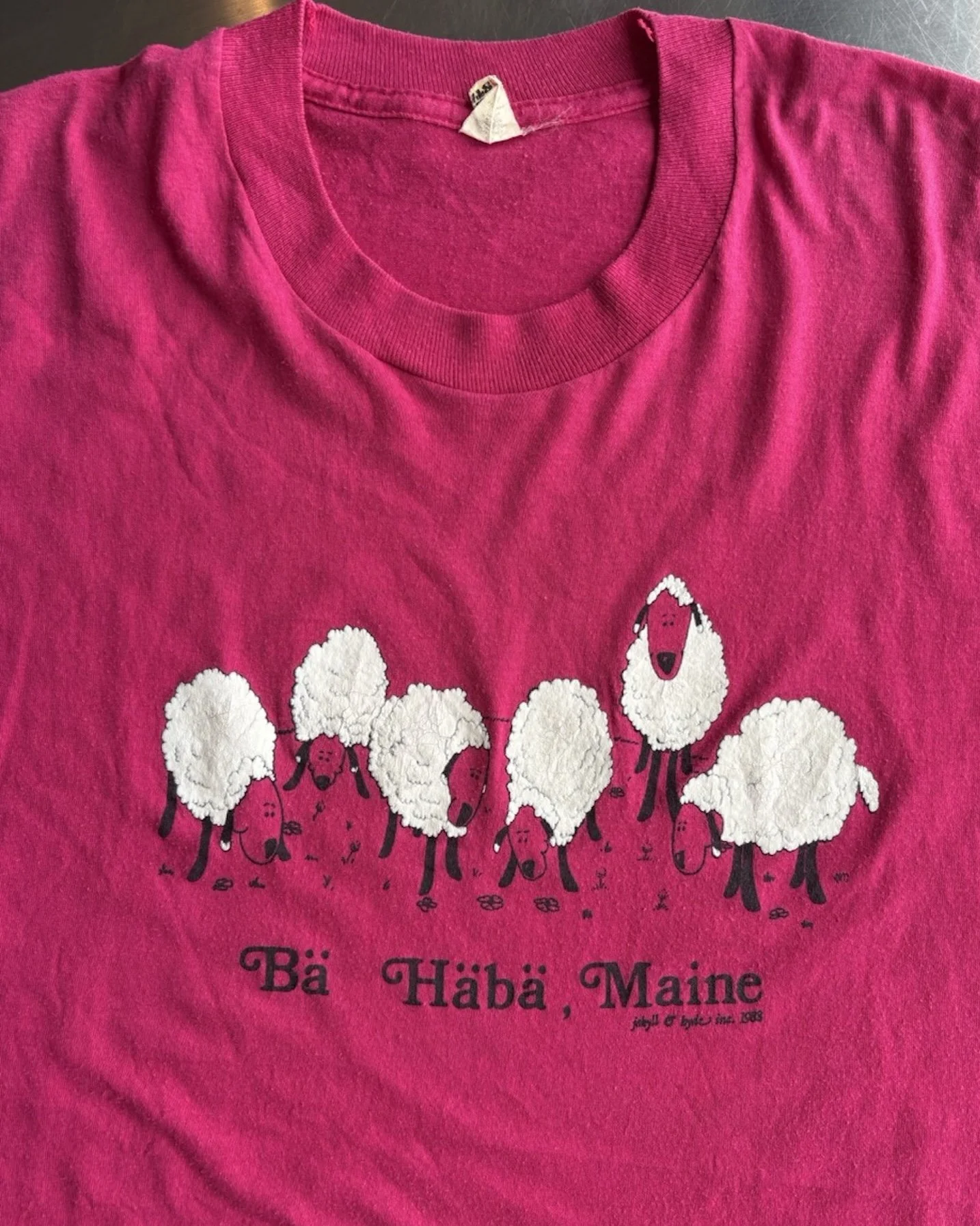 Neckline and shoulder detail on vintage pink Bä Häbä Maine sheep t-shirt