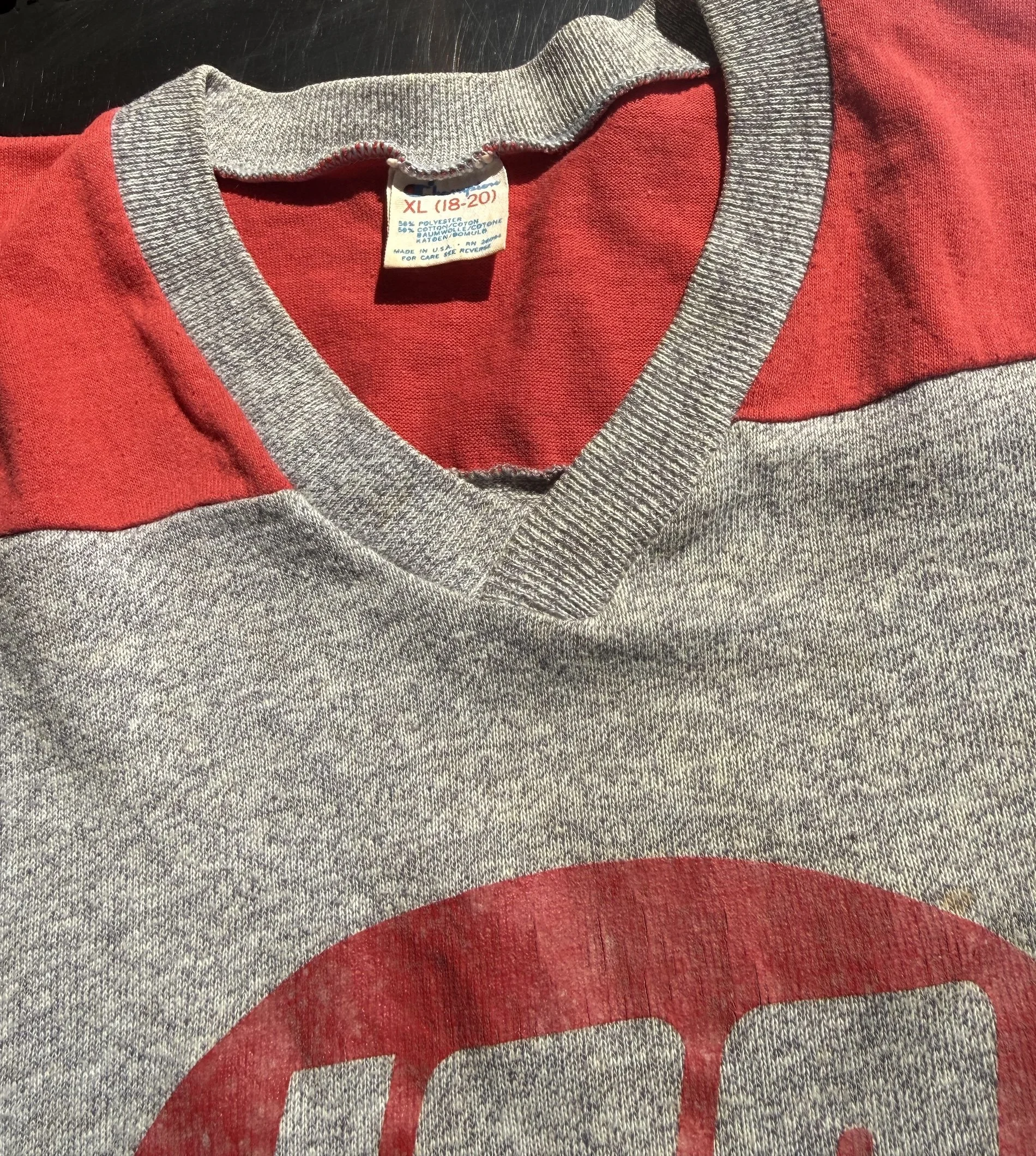 Champion neck label and V-neckline detail on vintage grey ICA jersey t-shirt