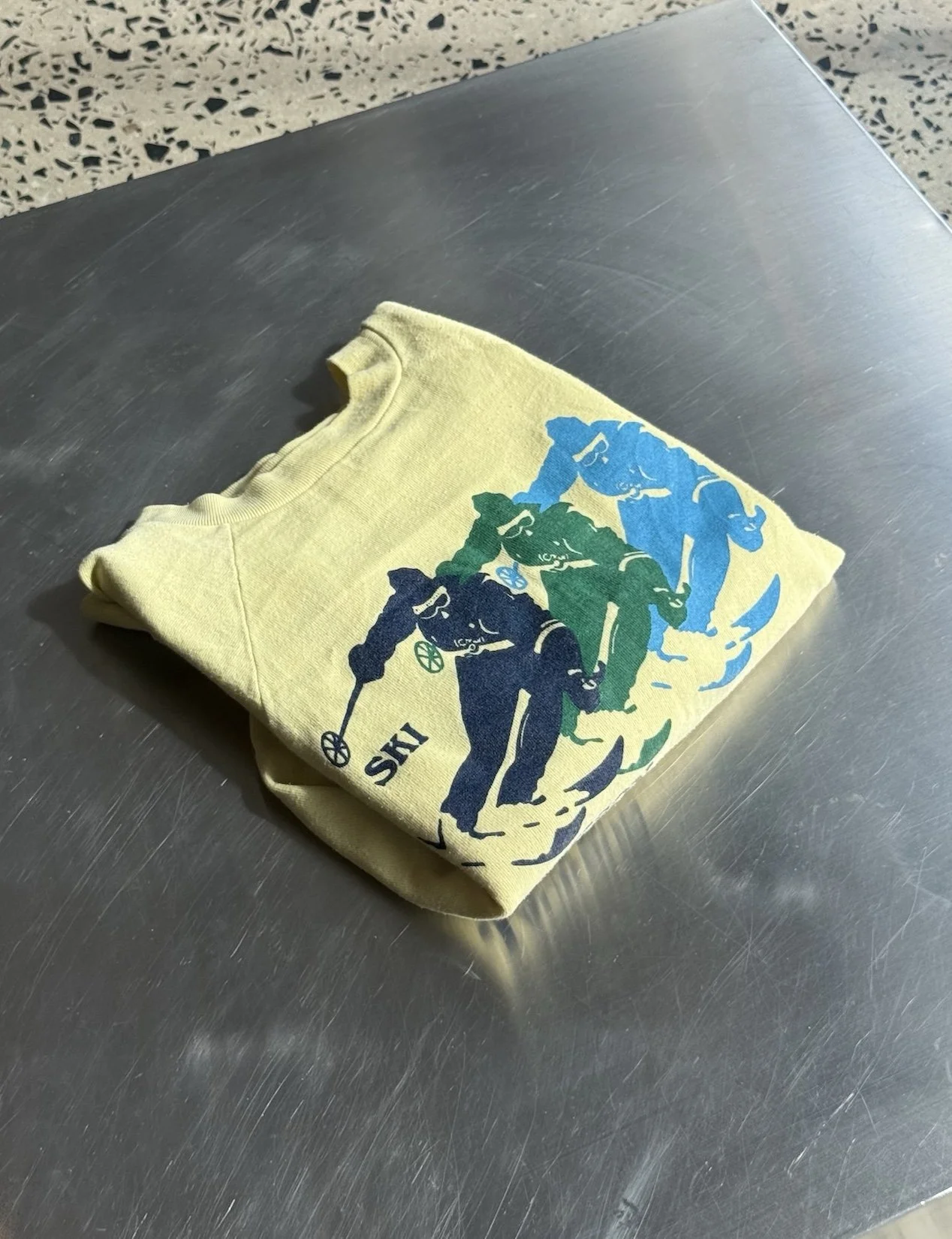 vintage-jackson-hole-ski-yellow-sweatshirt-flatlay-folded.jpeg