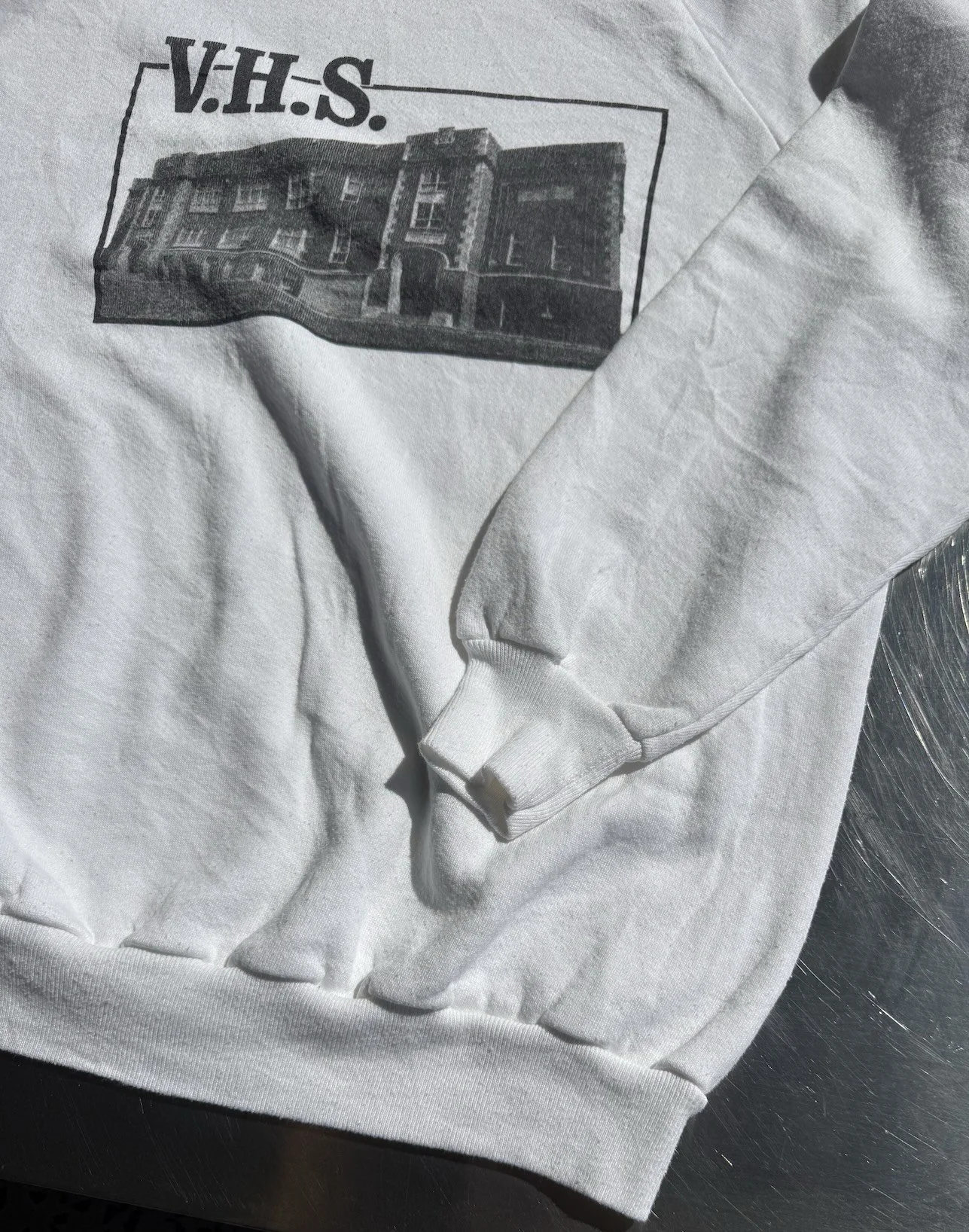 Neckline and Springfoot label detail on vintage white V.H.S. school sweatshirt