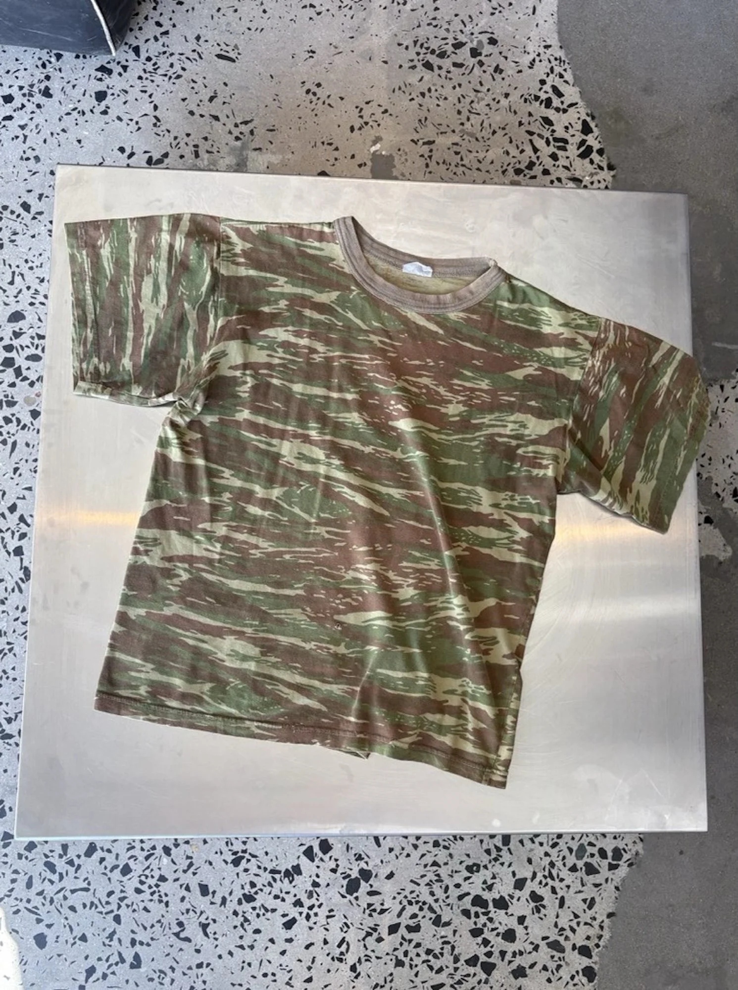Vintage camo t-shirt laid flat, full front view