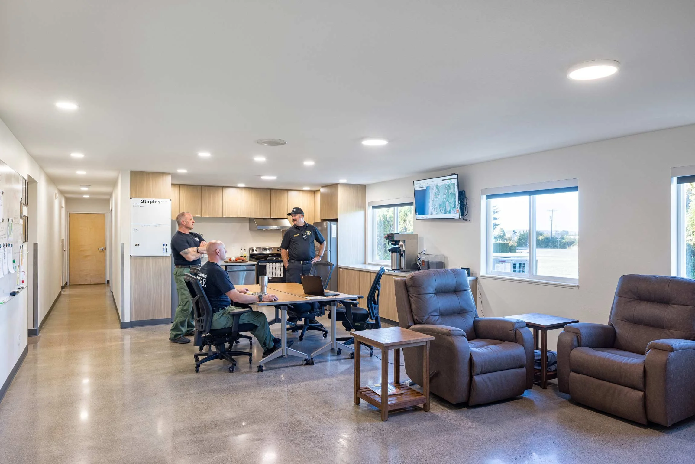 Firemen in staff kitchen and living room
