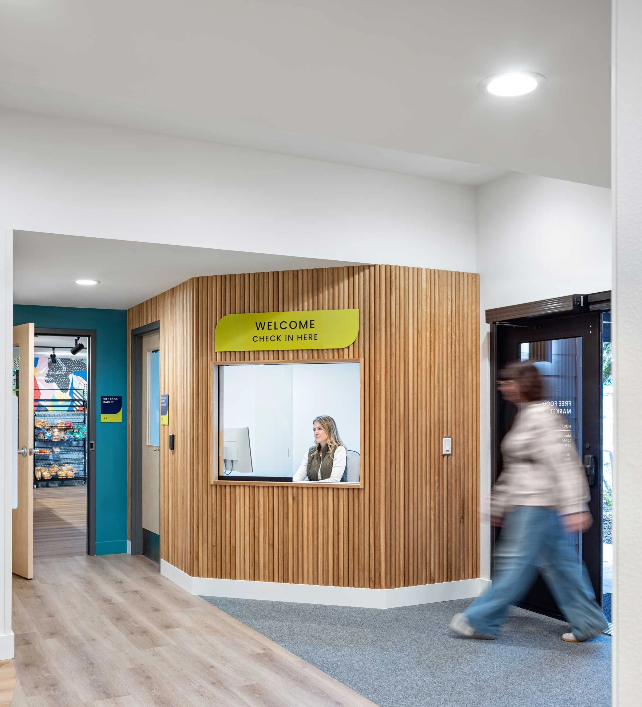 Food pantry check-in with window and slatted wall feature