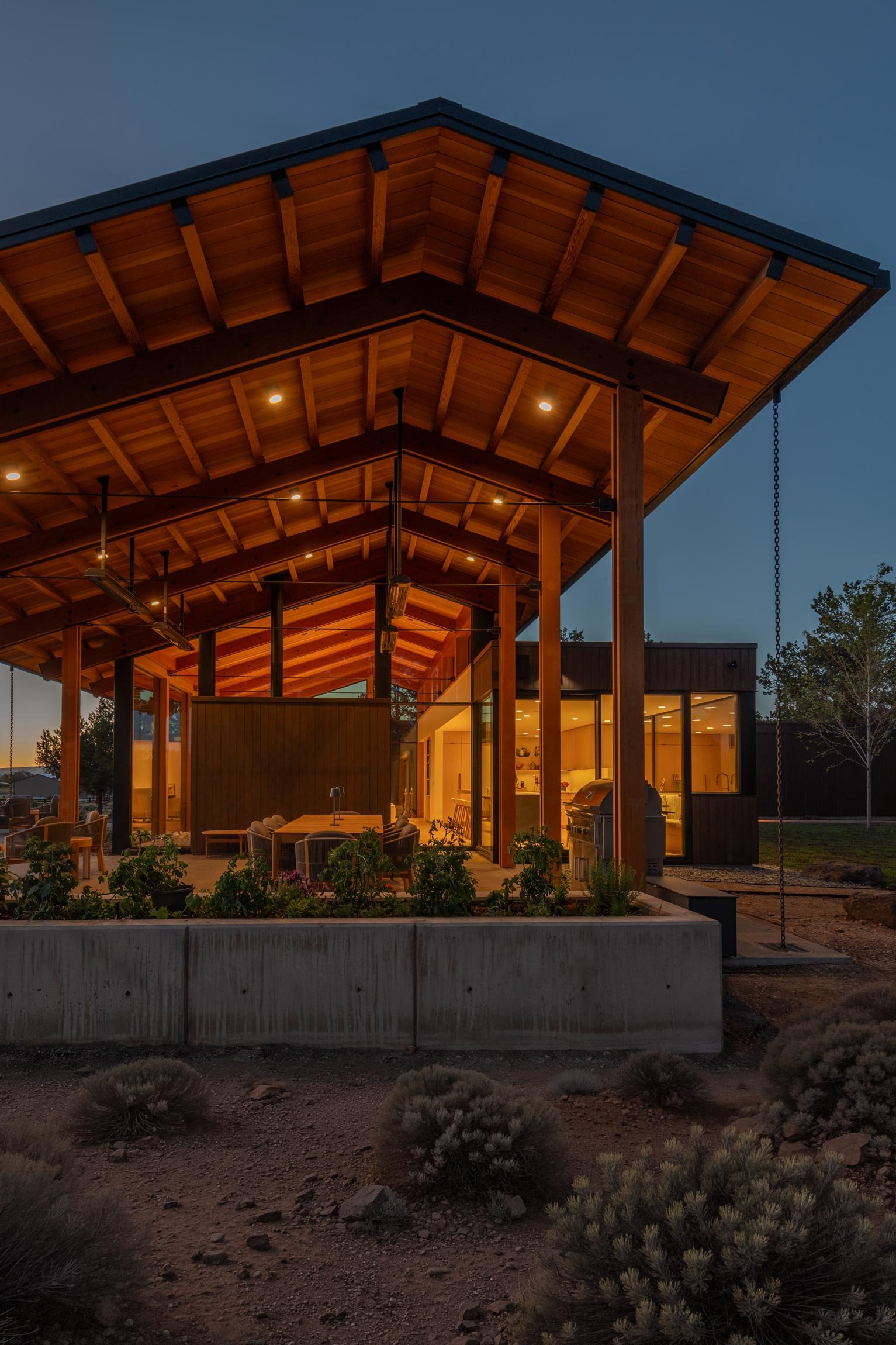 Outdoor covered patio with seating and bbq
