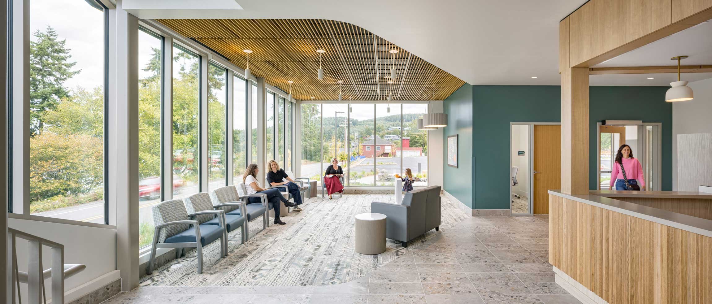 Main lobby facing seating area near floor ceiling windows