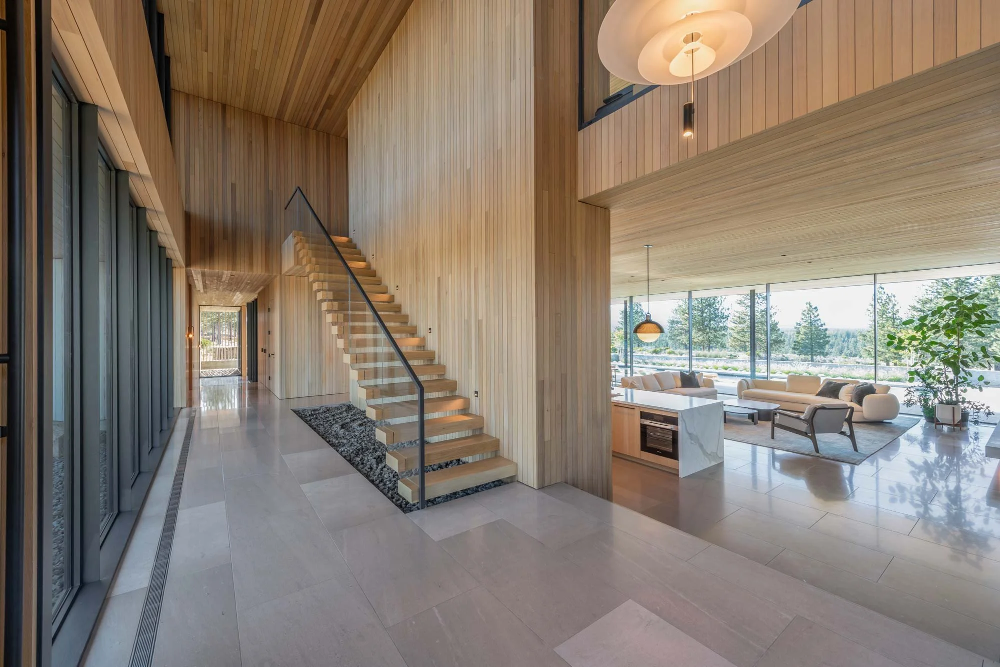 Foyer with wood stairs and tile floors