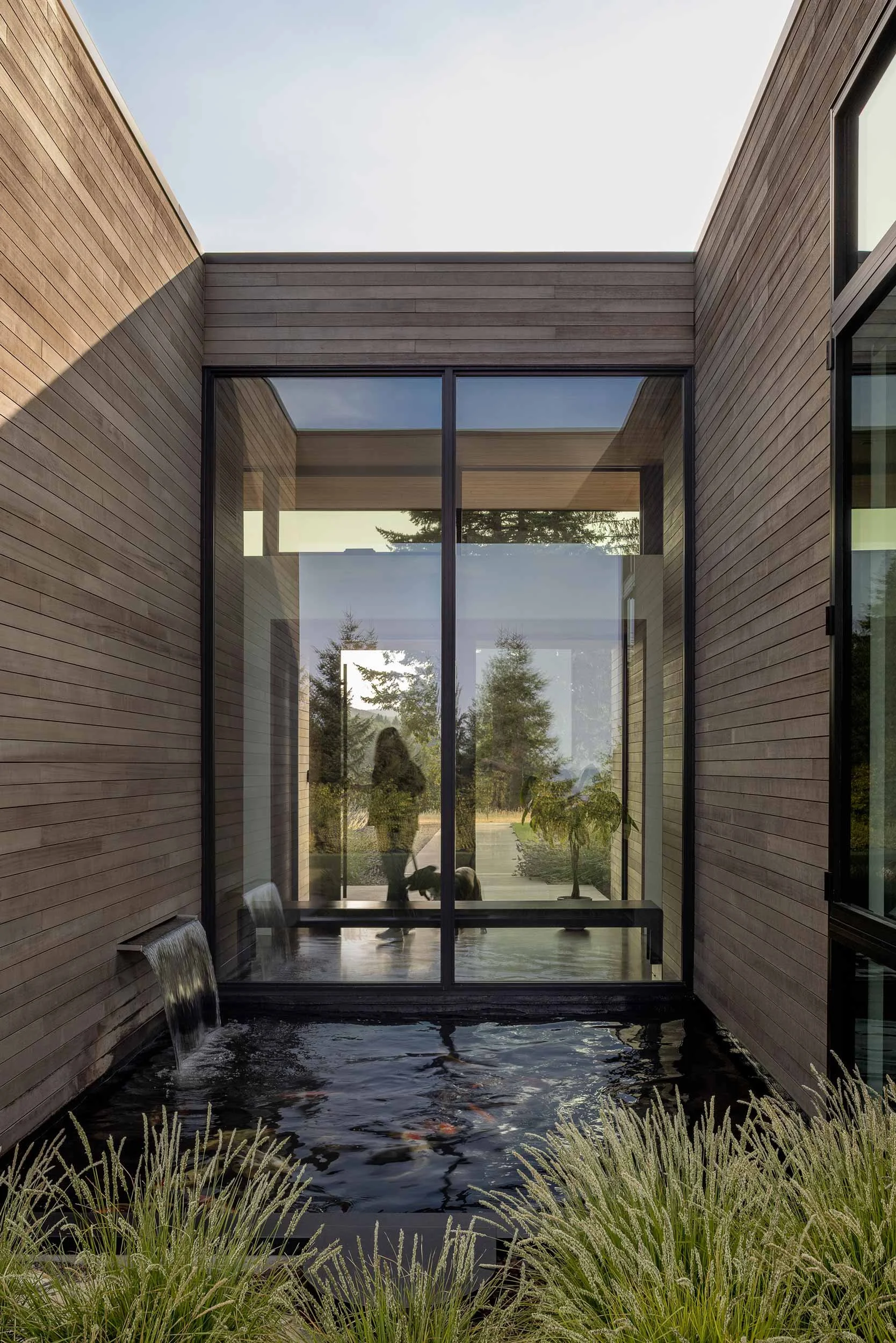 View of a exterior koi pond and water feature from outside