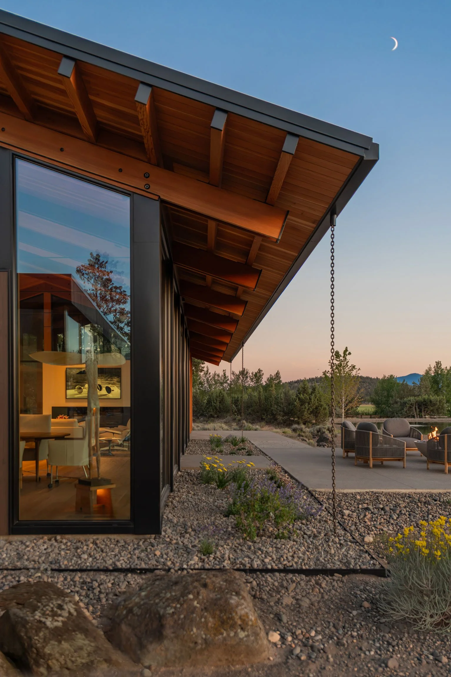Outdoor patio with rain chains and wooden soffets