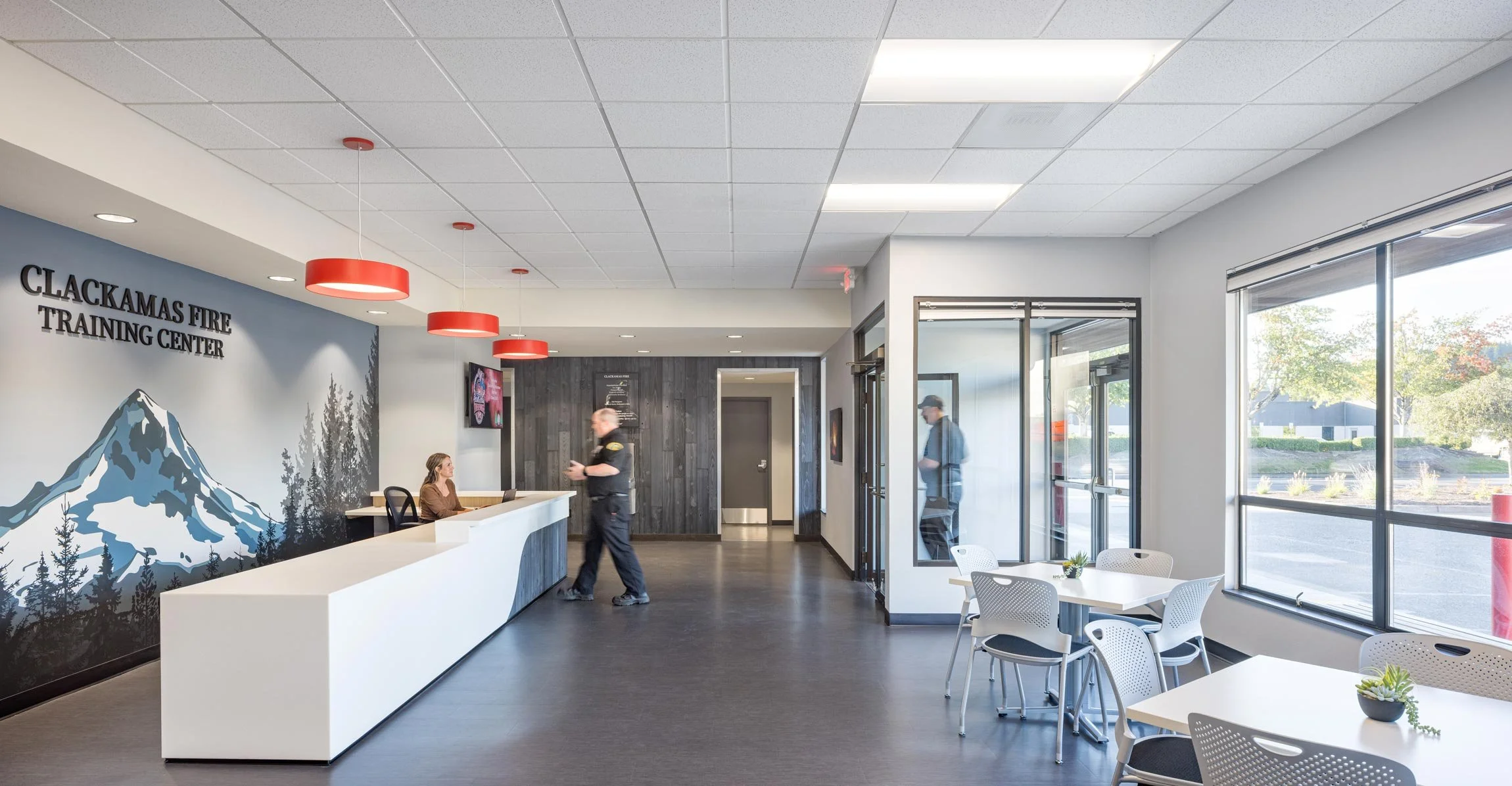 Front entry with wall graphic and bold red lighting