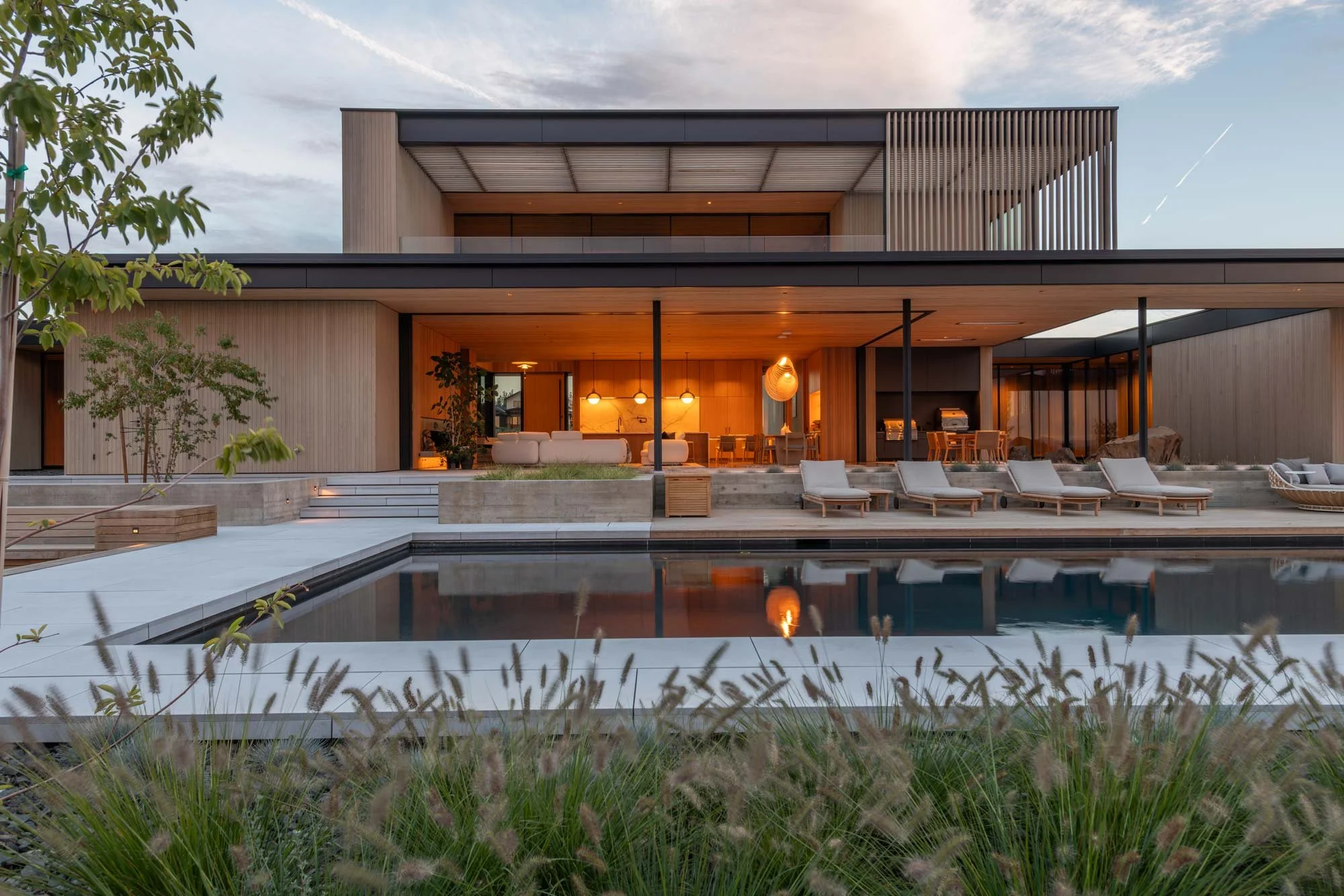 Backyard with view of house at dusk